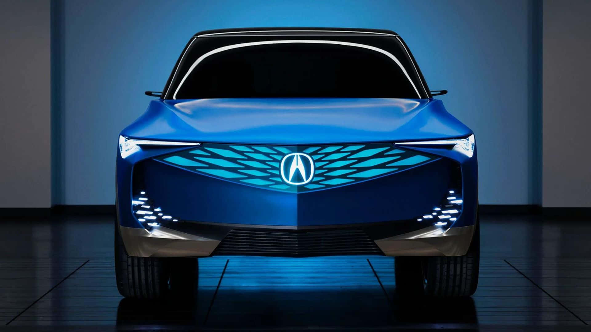 Acura Zdx 桌布 壁紙 — 一款時尚的藍色Acura概念車在工作室燈光下閃耀，配備未來感LED頭燈和發光格柵。