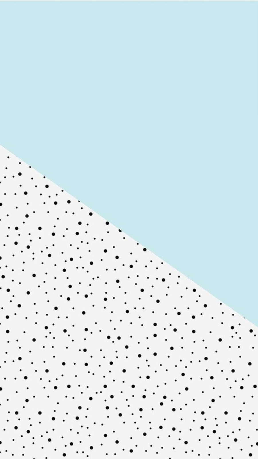 Black And White Dots 桌布 壁紙 — 一款極簡風格牆紙，以淺藍色和白色圓點圖案對角分割。