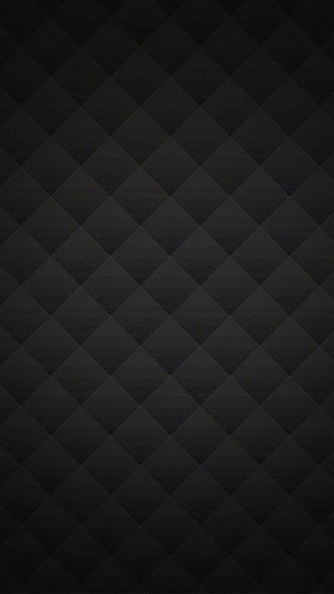 Smartphone 桌布 壁紙 — 一款極簡黑色牆紙，帶有細膩的菱形絎縫紋理和柔和漸變燈光。