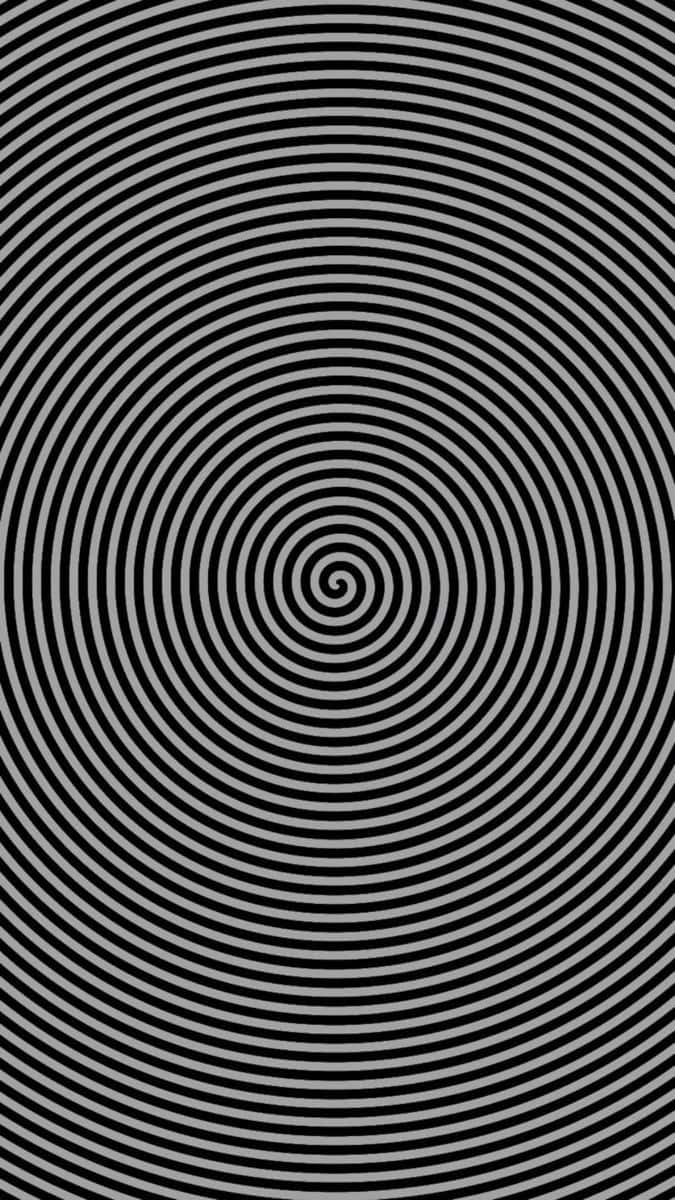 黑色和灰色同心圓形成催眠螺旋圖案。