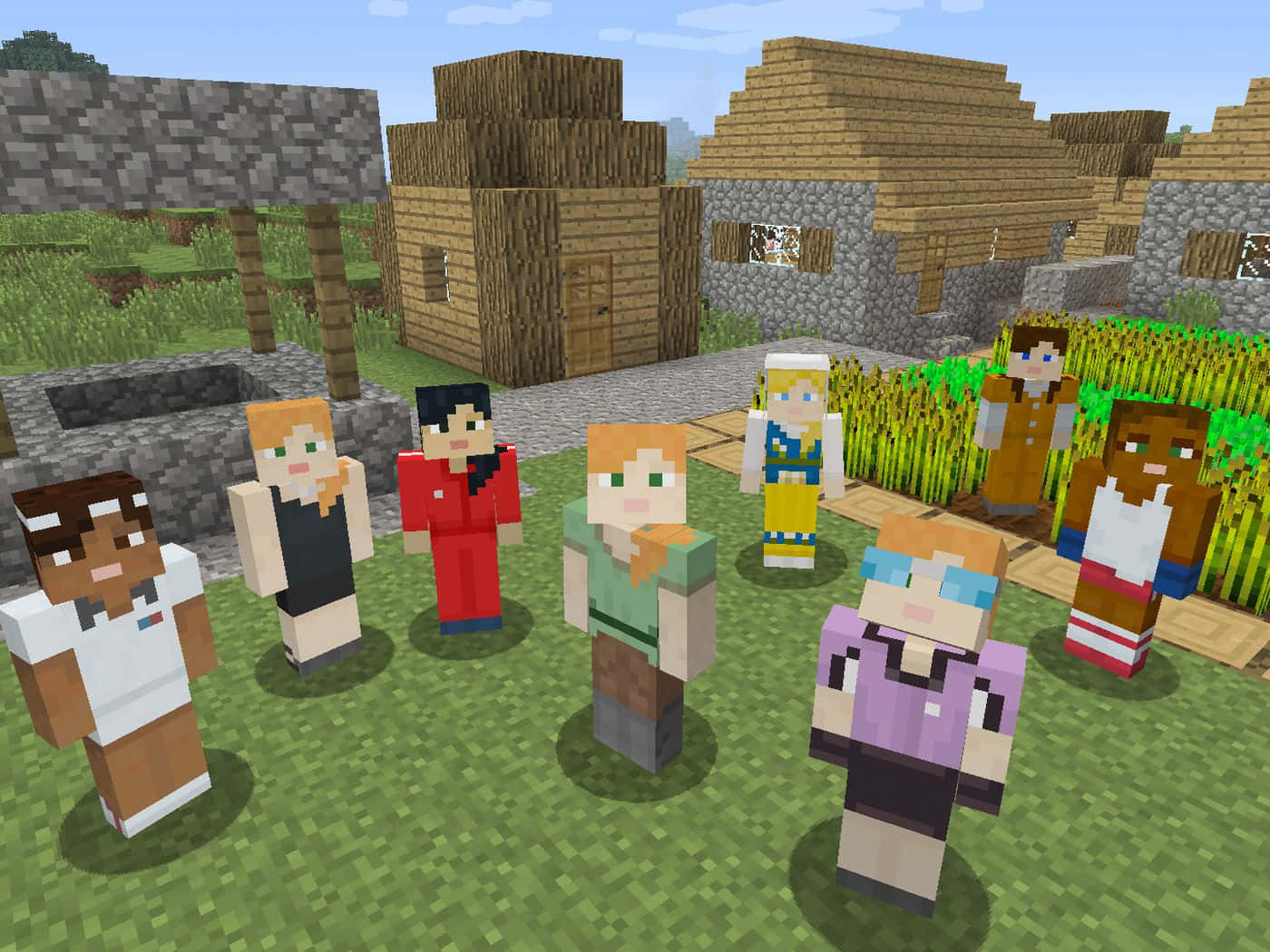 Minecraft Alex 桌布 壁紙 — 一群Minecraft村民站在一個有草地、木屋和石屋的村莊，天空清澈湛藍。