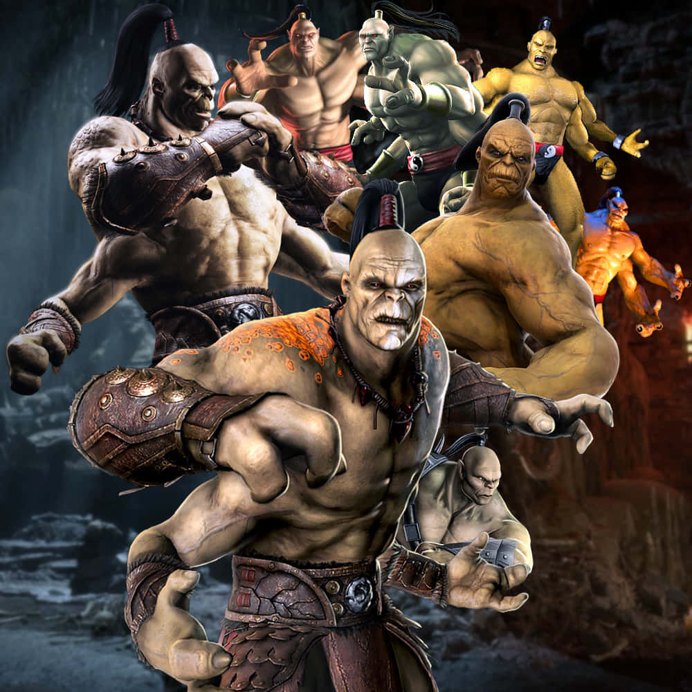 Mortal Kombat Goro 桌布 壁紙 — 一群肌肉發達的奇幻戰士，身穿部落盔甲，表情兇猛，站在一個黑暗的洞穴般的環境中。