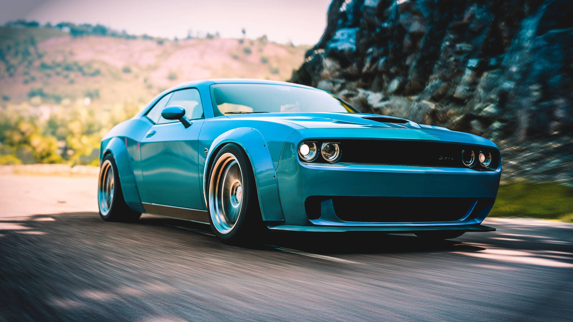 青綠色肌肉車在日落時分於山路奔馳 — Dodge challenger GIF 壁紙