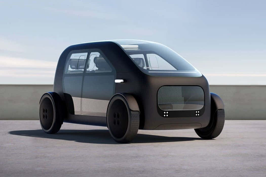 Minimalist Car 桌布 壁紙 — 一輛時尚未來感黑色小型車，配備大輪胎和極簡設計，停泊在晴朗天空下的混凝土表面上。