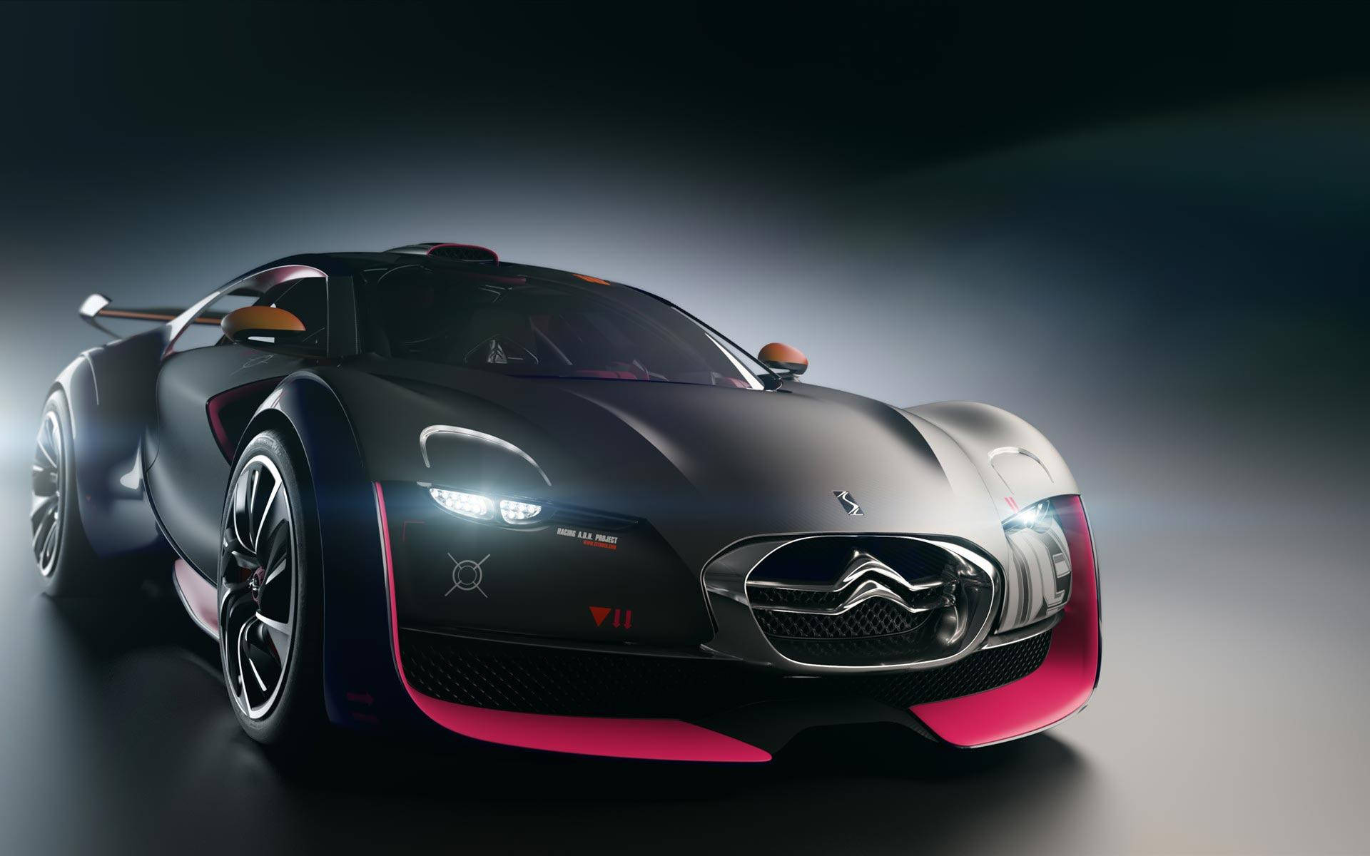 Sports Car 桌布 壁紙 — 一輛時尚的啞光黑色雪鐵龍概念車，帶有充滿活力的粉紅色點綴和發光車頭燈，在黑暗的攝影棚中戲劇性地擺拍。