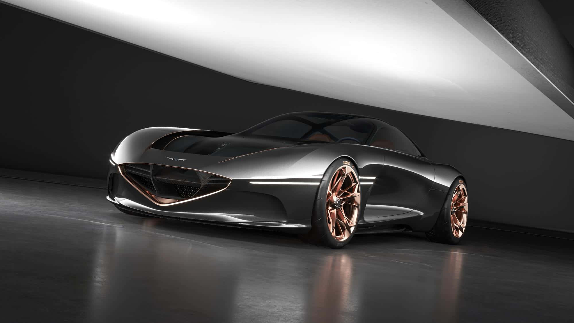 Genesis Essentia 桌布 壁紙 — 一輛時尚的未來主義跑車，採用金屬灰色車身和銅色輪圈，在戲劇性的工作室燈光下閃閃發光。