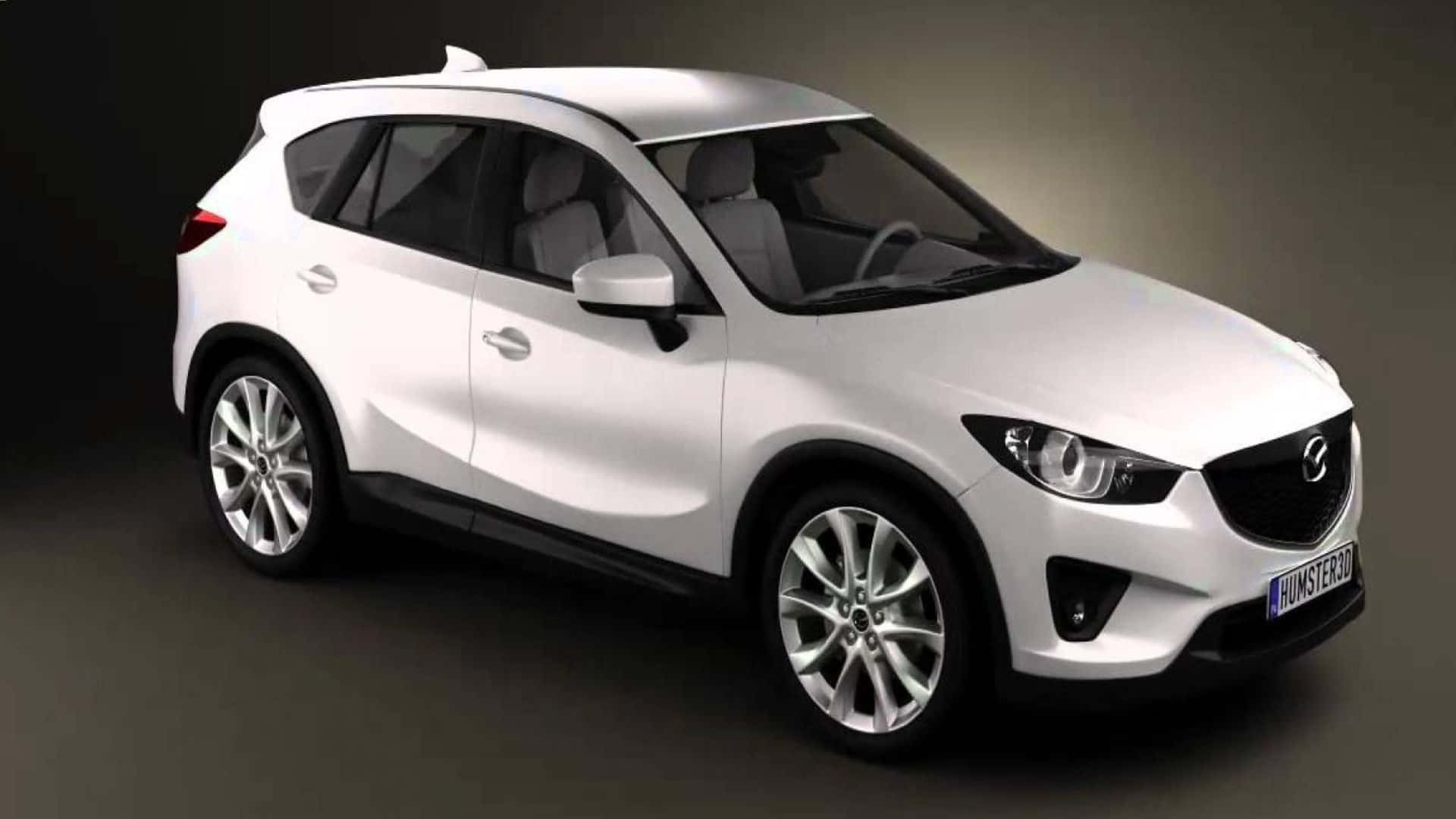 Mazda Cx-5 桌布 壁紙 — 一輛時尚的白色Mazda CX-3 SUV在攝影棚內以戲劇性燈光和深色背景展示。