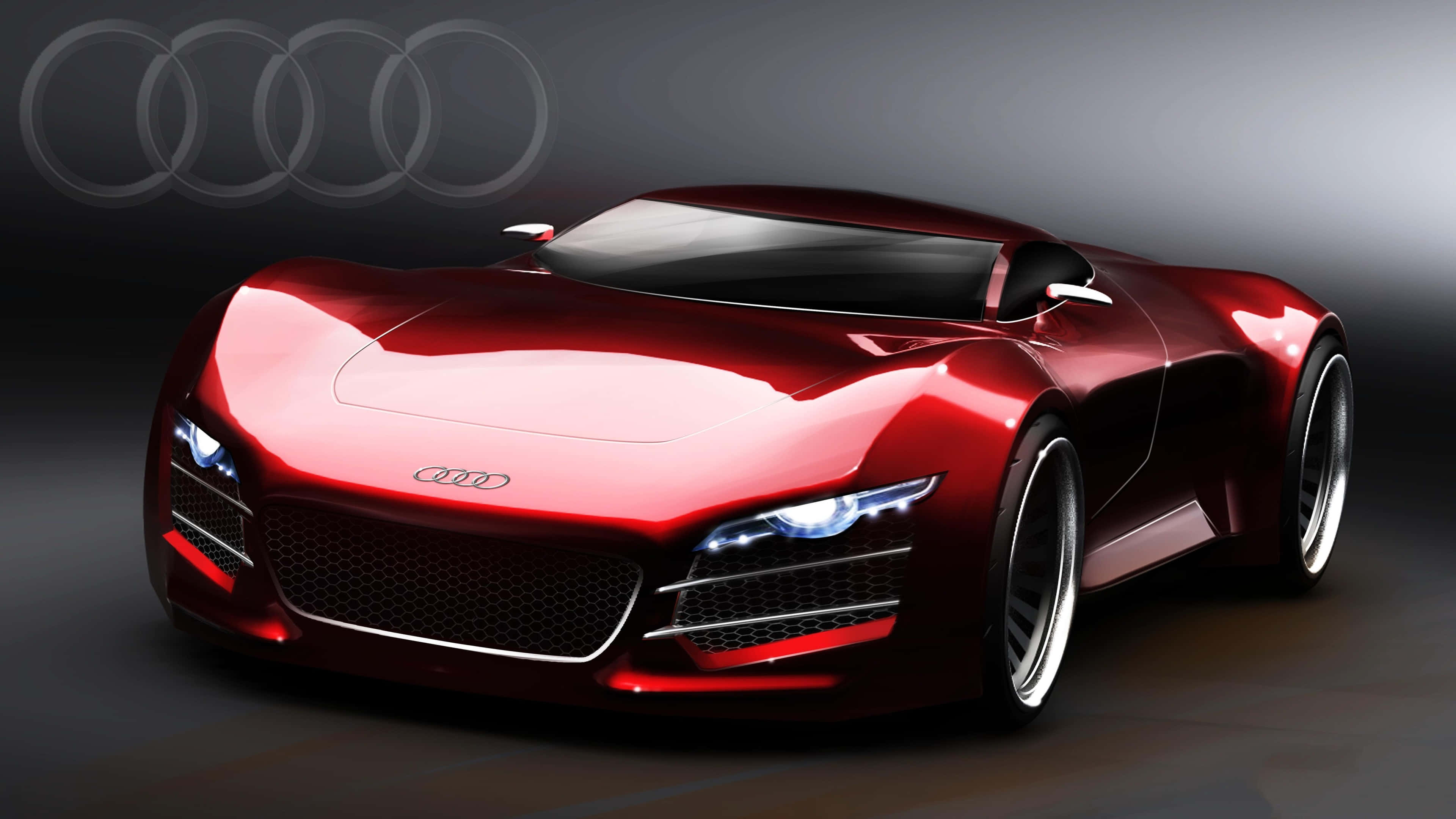 4K Car 桌布 壁紙 — 一輛時尚的紅色奧迪概念車，帶有發光頭燈和四環標誌，背景為深色工作室。