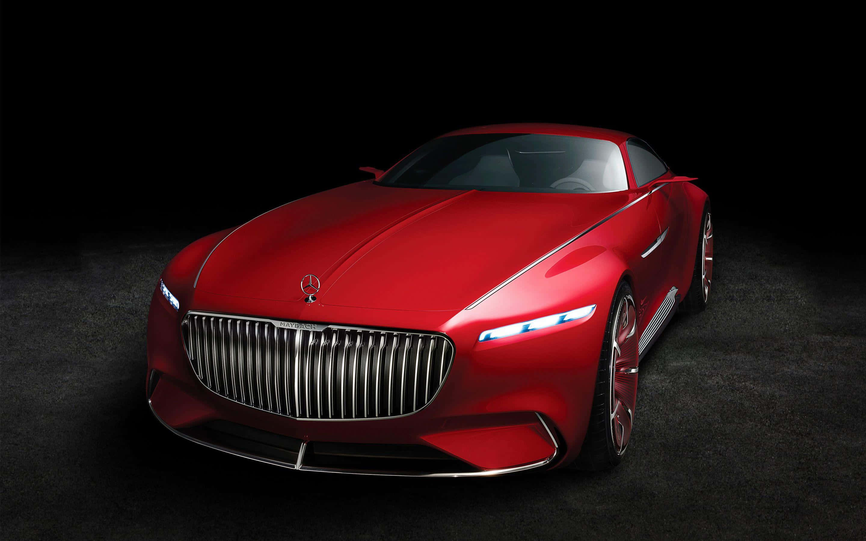 Maybach 桌布 壁紙 — 一輛時尚的紅色梅賽德斯概念車在黑色背景的攝影棚燈光下閃耀。
