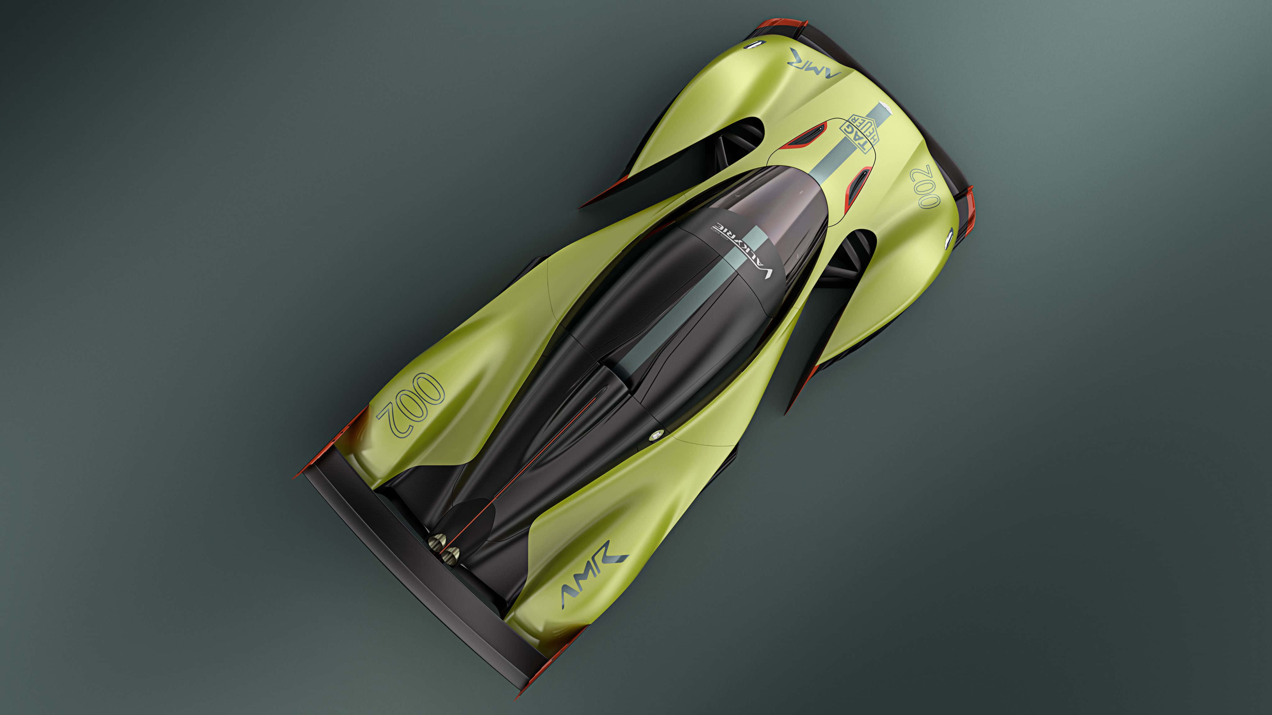Aston Martin Valkyrie 桌布 壁紙 — 一輛時尚的螢光綠和黑色賽車，從上方俯視，背景為深灰色工作室背景。