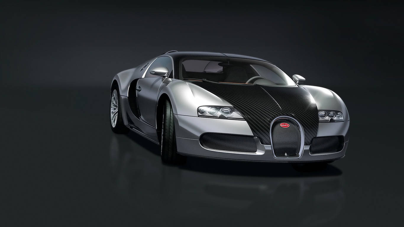 Sports Car 桌布 壁紙 — 一輛時尚的銀色Bugatti Veyron配以碳纖維飾邊，在黑暗反光地板上於工作室燈光下閃閃發光。