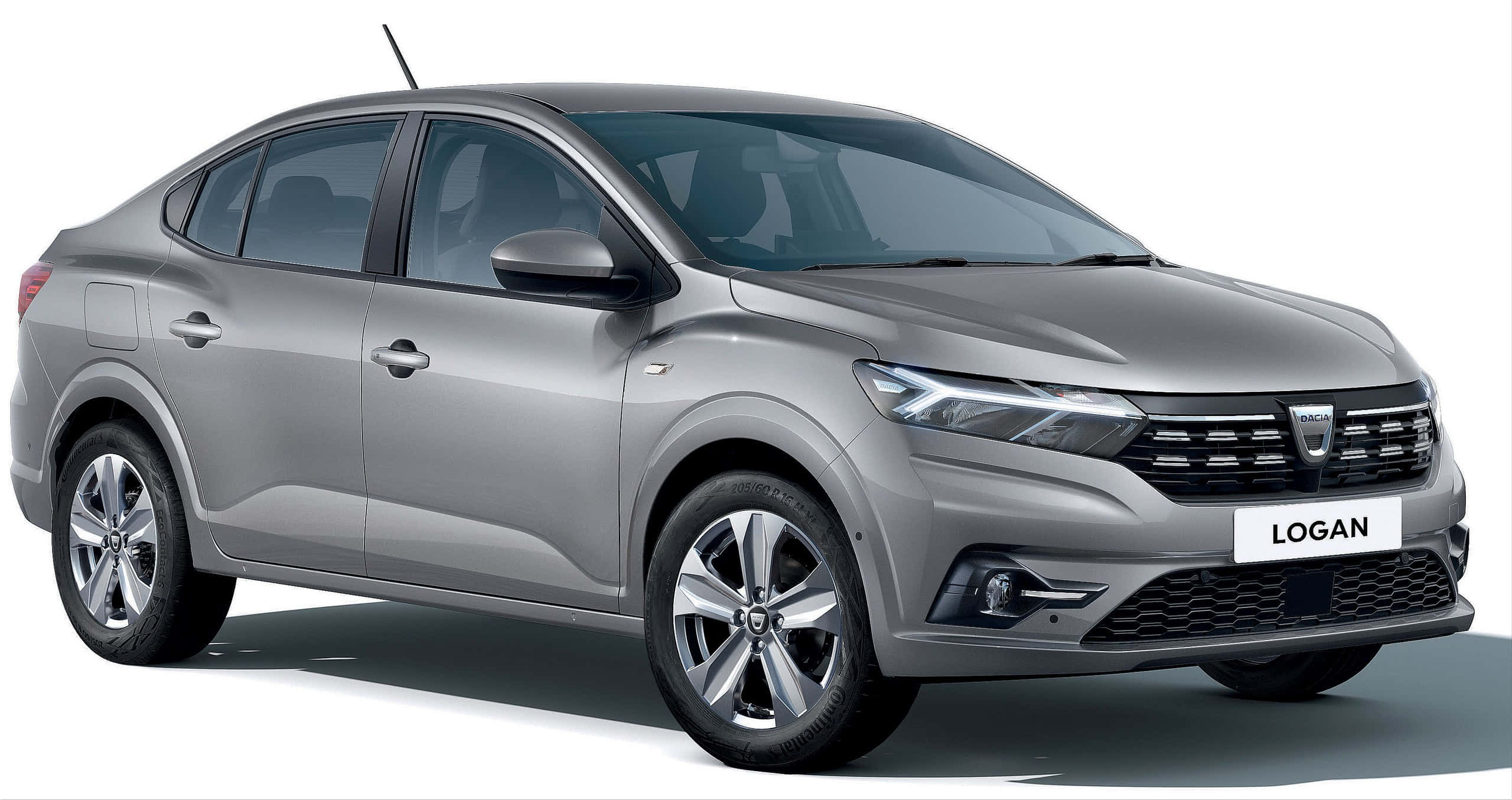 Dacia 桌布 壁紙 — 一輛時尚的銀色Dacia Logan轎車在工作室燈光下展示，線條簡潔，車頭燈現代化。