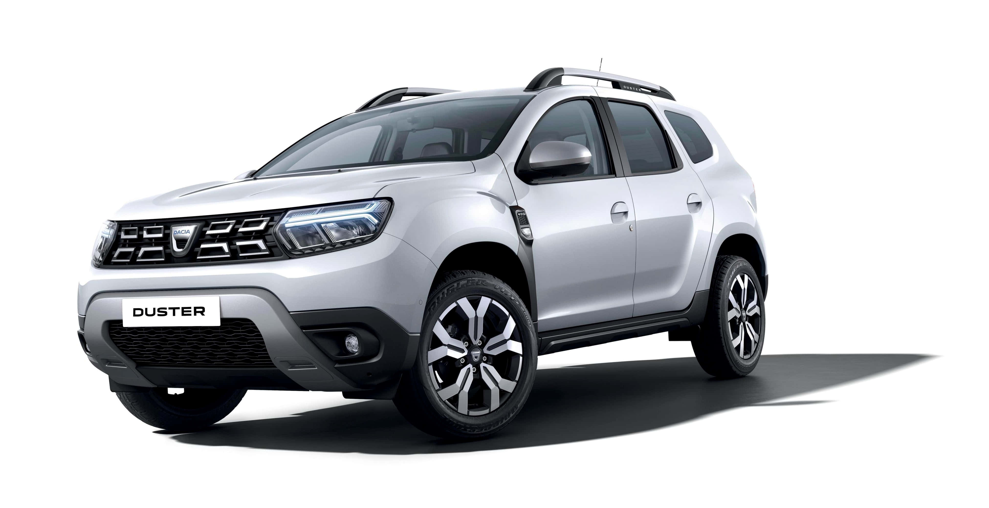 Dacia 桌布 壁紙 — 一輛時尚的銀色Duster SUV在潔白背景前矗立，在其現代合金輪轂下投下清晰的陰影。