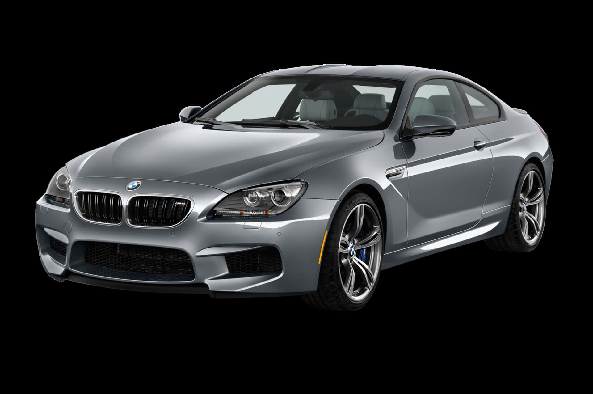 Bmw M6 桌布 壁紙 — 一輛時尚的銀色寶馬M6轎跑車在純黑色背景下的攝影棚燈光中閃耀，展現其激進的空氣動力學設計。