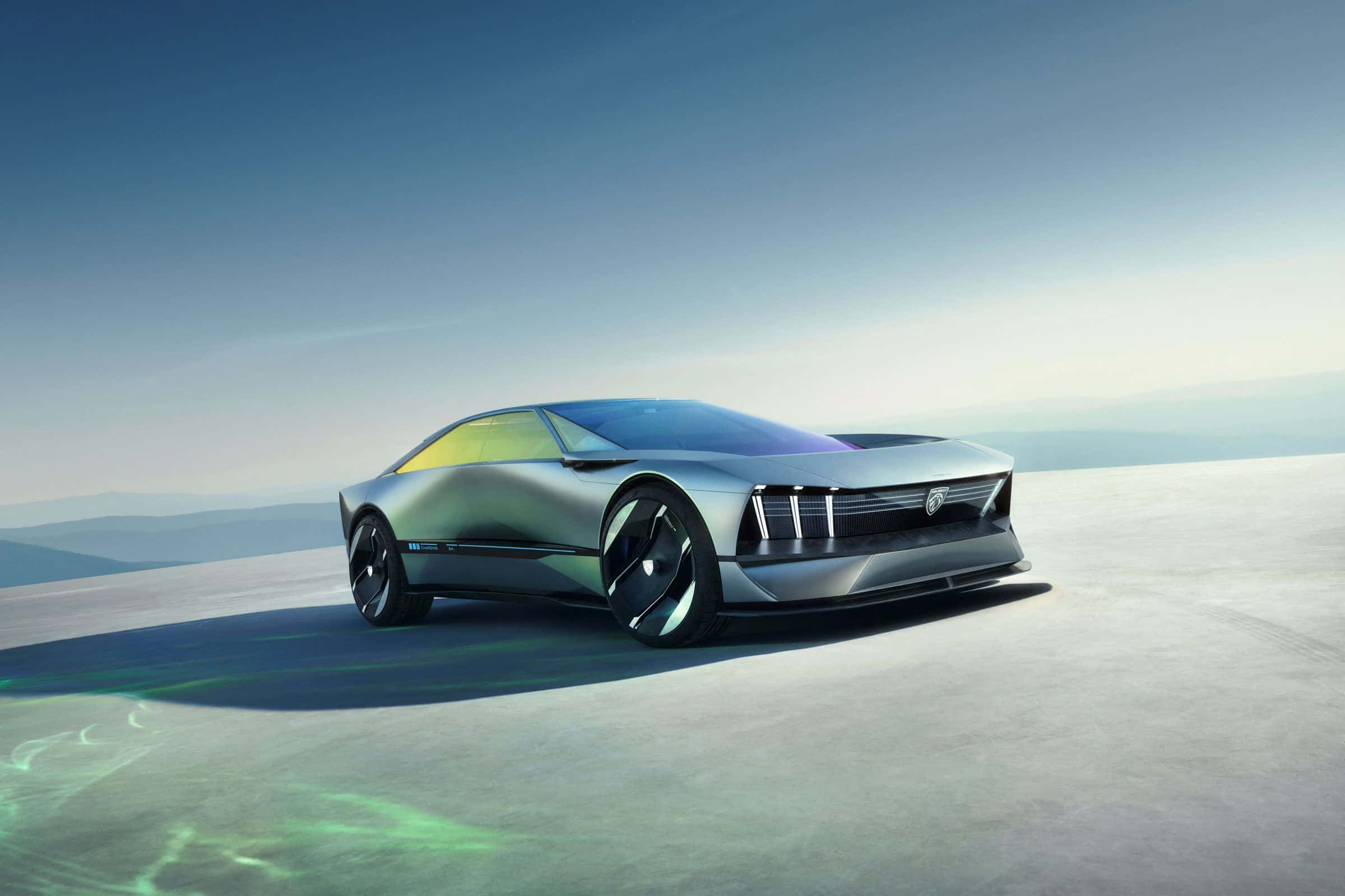 Sports Car 桌布 壁紙 — 一輛時尚的銀色未來感跑車，帶有發光的綠色點綴，停放在晴朗藍天下廣闊的平原上。