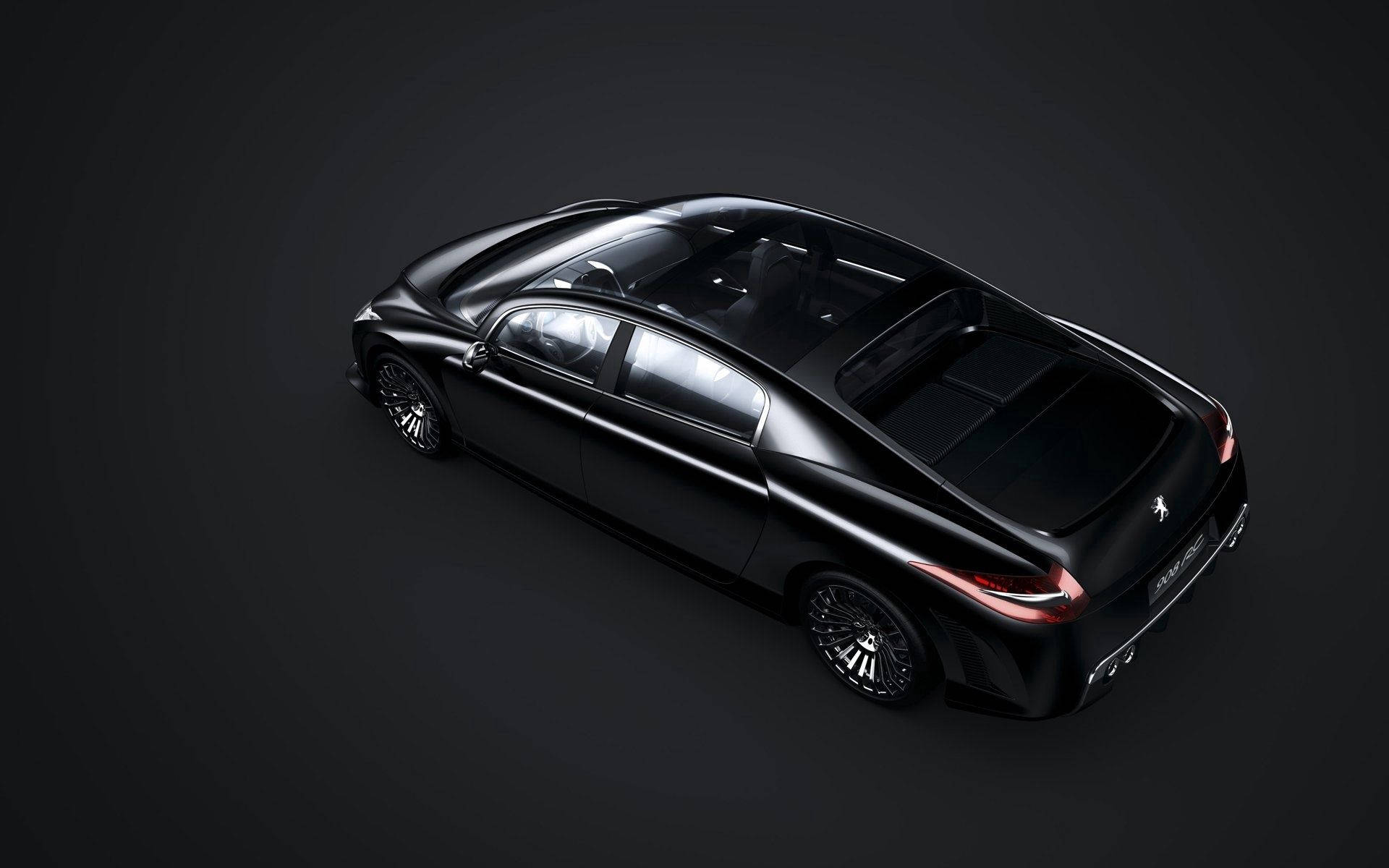 Peugeot 908 RC 壁紙 — 一輛時尚的黑色豪華轎車，帶有發光的紅色尾燈，在極簡的黑暗工作室環境中展示。