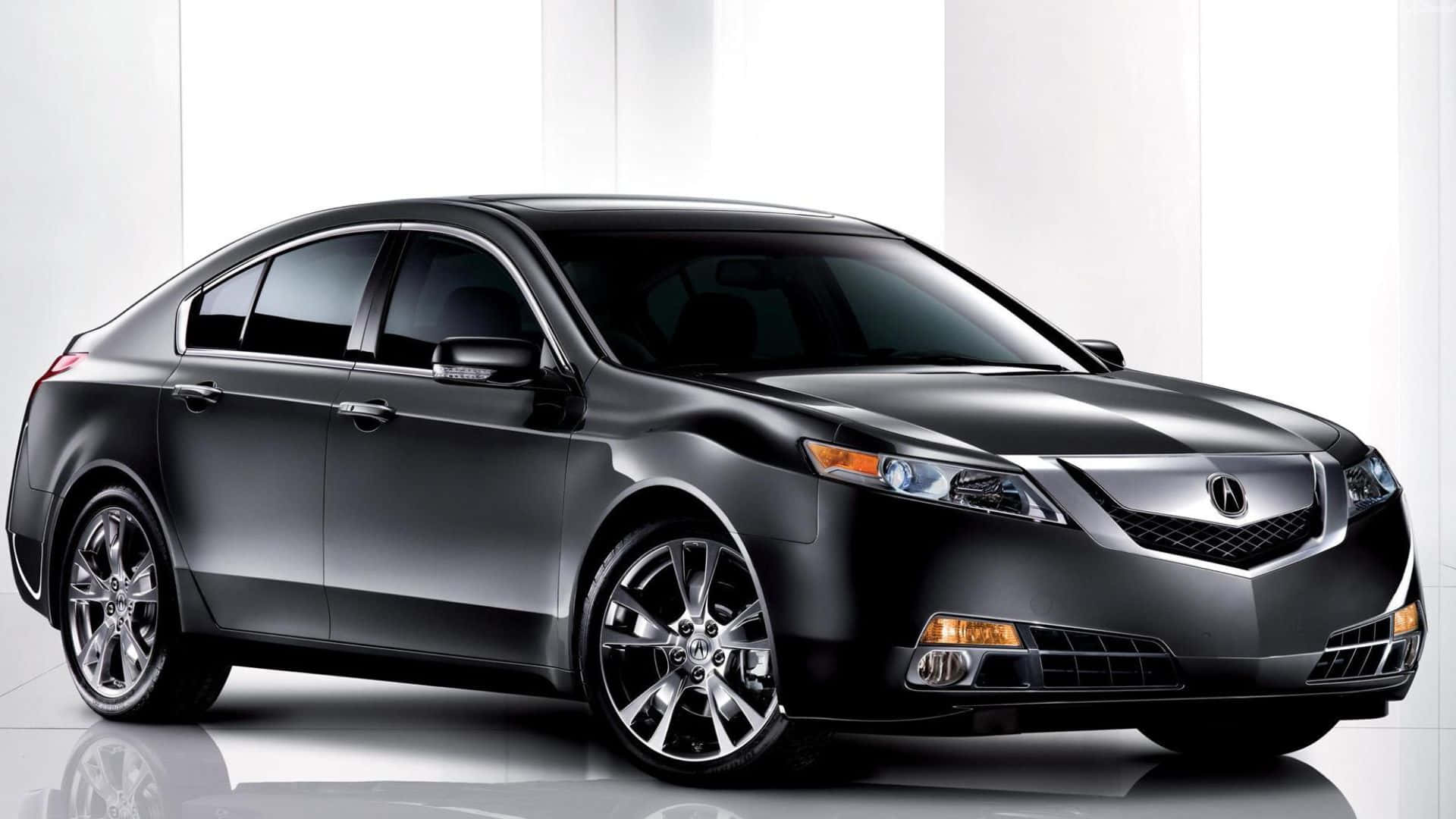 Acura Tl 桌布 壁紙 — 一輛時尚的黑色豪華轎車，帶有鍍鉻飾邊和合金輪圈，在明亮的極簡主義工作室環境中展示。