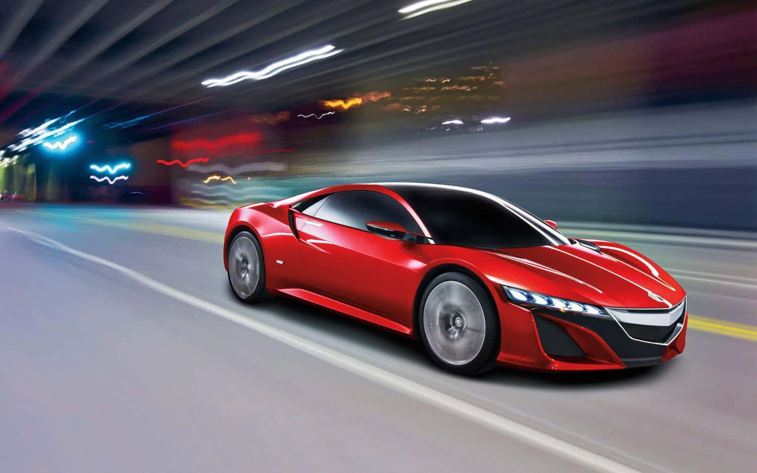Acura Nsx 桌布 壁紙 — 一輛流線型紅色跑車在霓虹燈隧道中疾馳，模糊的城市燈光掠過。