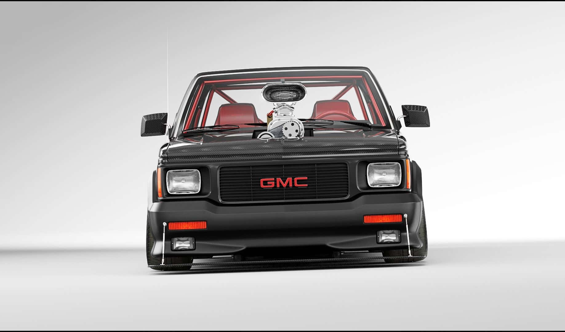 Gmc Syclone 桌布 壁紙 — 一輛黑色GMC賽車，引擎外露，紅色內飾，正面朝向純白色工作室背景。