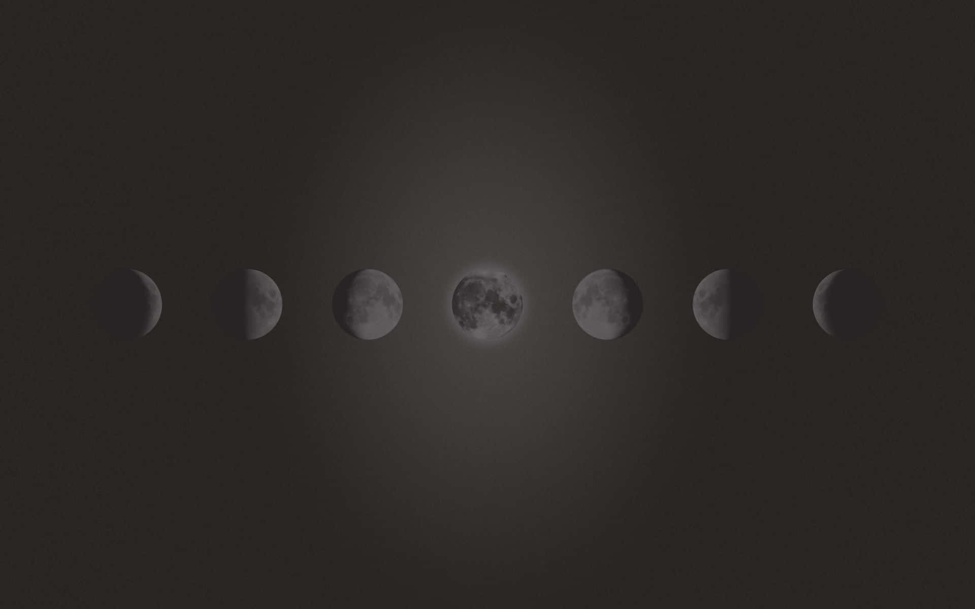 Moon Phases 桌布 壁紙 — 一連串寧靜的月相，在深色漸變天空中柔和發光。