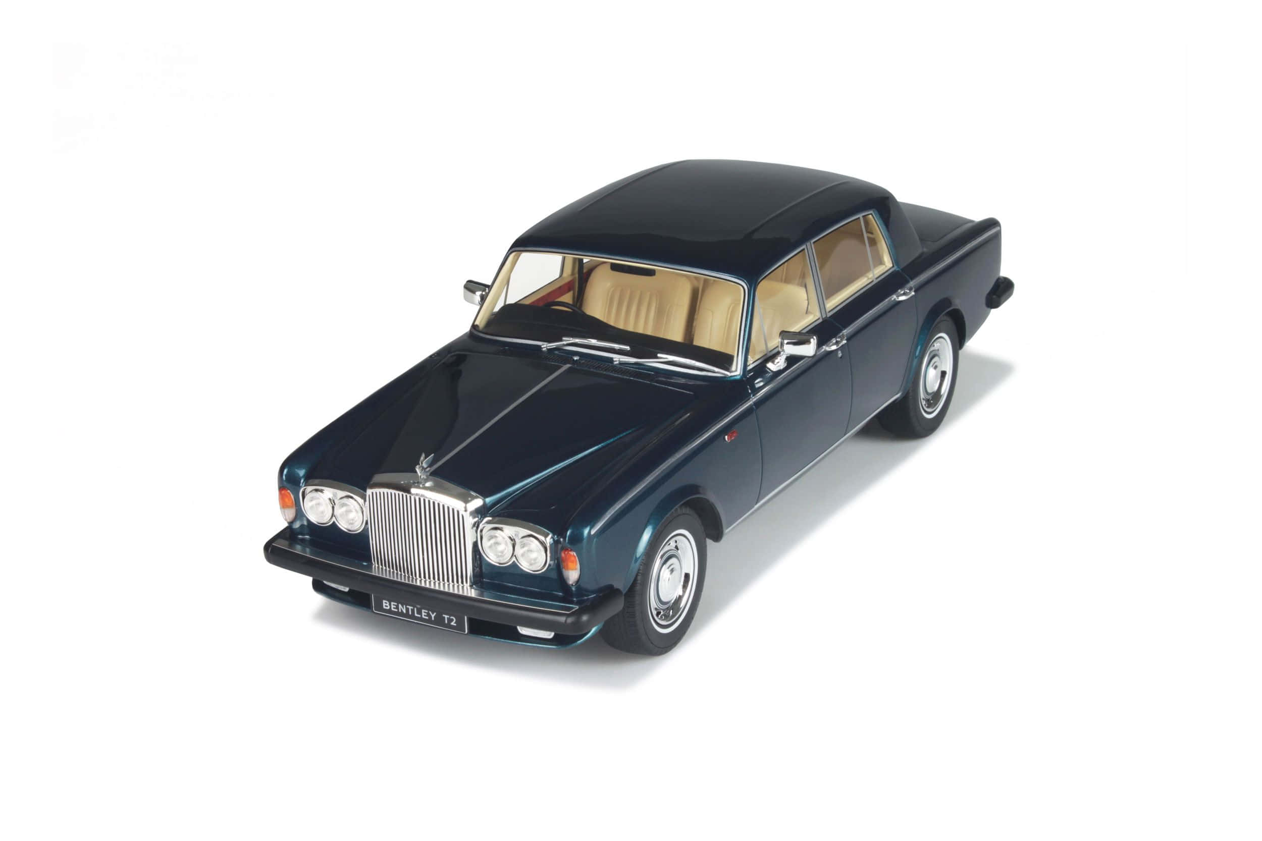 Bentley T2 桌布 壁紙 — 一部時尚深藍色賓利T2模型車，配備米色內飾，展示在潔白背景上。