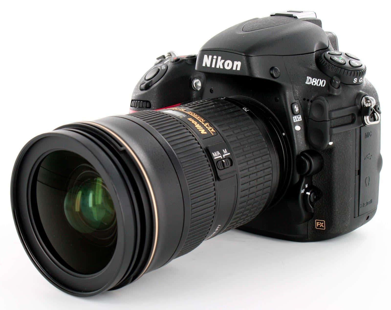 Dslr Camera 桌布 壁紙 — 一部時尚的黑色 Nikon D800 DSLR 相機，配備一個大鏡頭，以一定角度放置在乾淨的白色背景前。