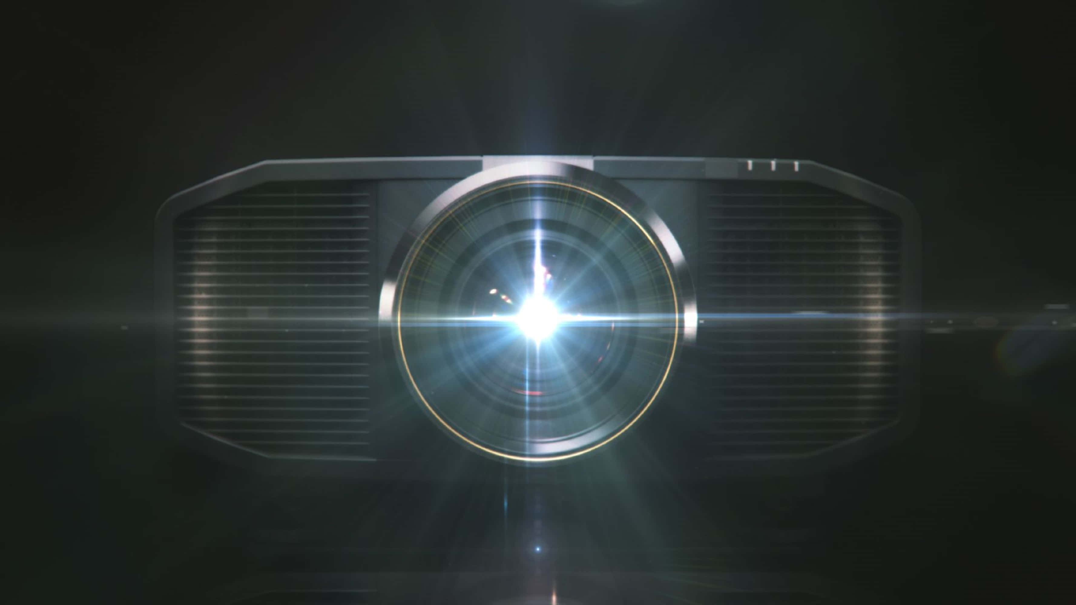 4K Projector 桌布 壁紙 — 一部未來風格的投影機在黑暗背景上發出明亮的星芒鏡頭光暈。