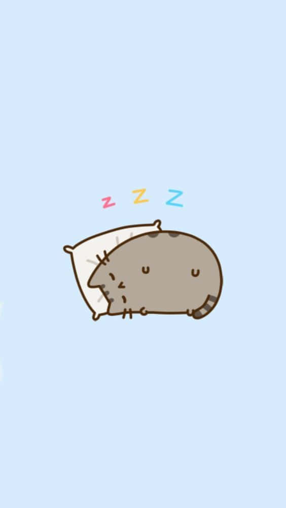 Cute Pusheen 桌布 壁紙 — 一隻可愛的卡通貓咪在枕頭上安詳地睡覺，頭頂上有色彩繽紛的zzz氣泡漂浮，背景是柔和的藍色。