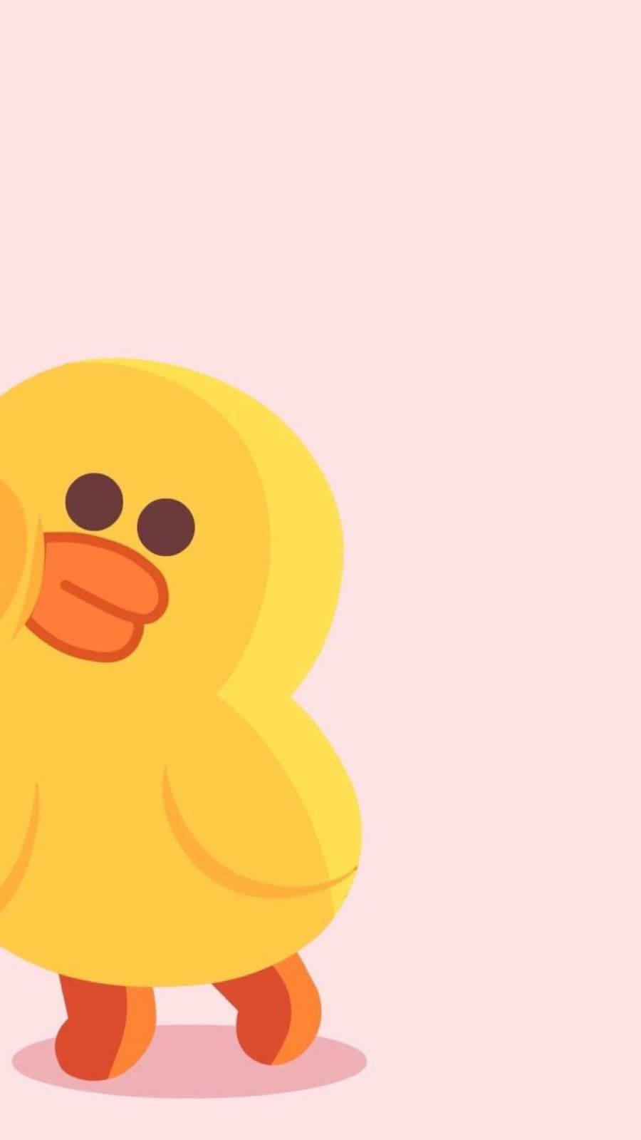 Duck 桌布 壁紙 — 一隻可愛的黃色卡通鴨，有橙色喙和腳，站在柔軟的粉紅色背景上。