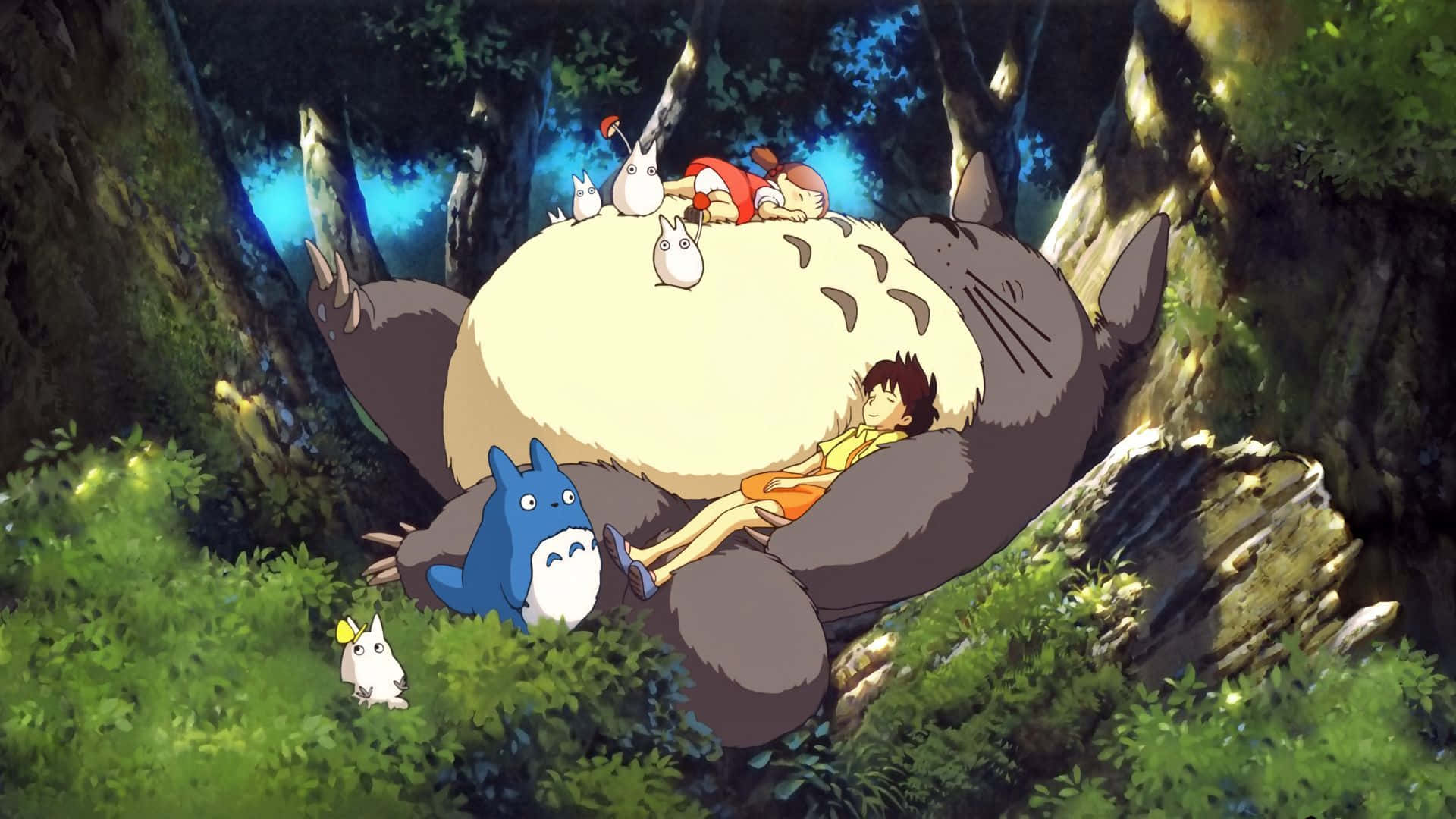 my neighbor totoro 桌布 壁紙 — 一隻巨大毛茸茸的龍貓在茂密的森林中休息，孩子們和小精靈在牠的背上和旁邊放鬆。