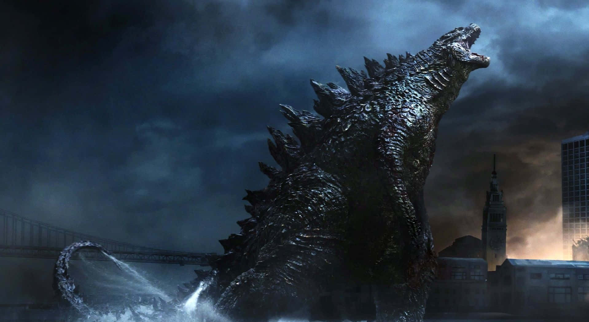 Godzilla 2014 桌布 壁紙 — 一隻巨大的哥斯拉從水中出現，置身於暴風雨中的城市景觀，高聳的建築物和陰暗不祥的天空。