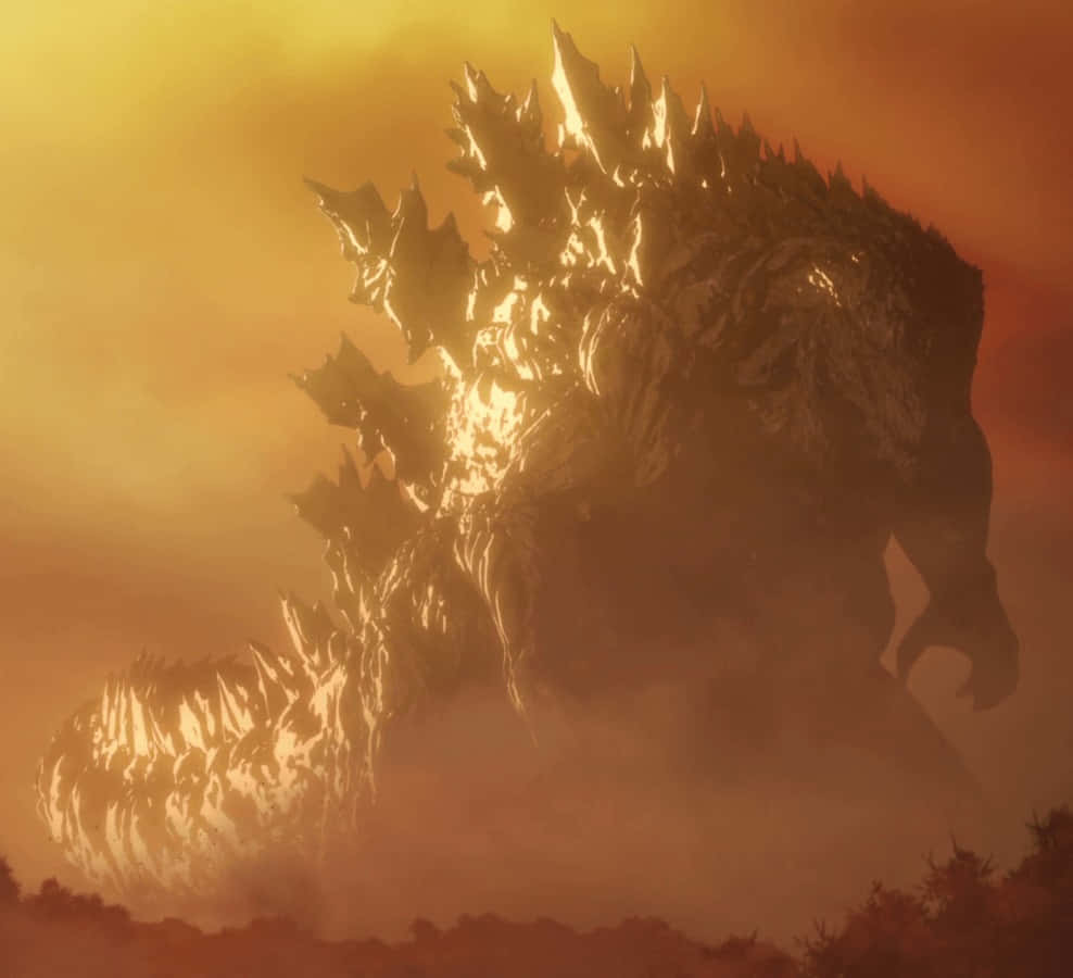Burning Godzilla 桌布 壁紙 — 一隻巨大的哥斯拉從煙霧中出現，在火紅橙色的天空下，背鰭發光。