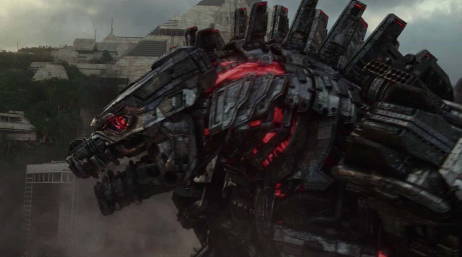 Robot Godzilla 桌布 壁紙 — 一隻巨大的生物機械怪獸，帶有發光的紅色眼睛和內部燈光，聳立在風暴天空下的廢墟城市景觀之上。