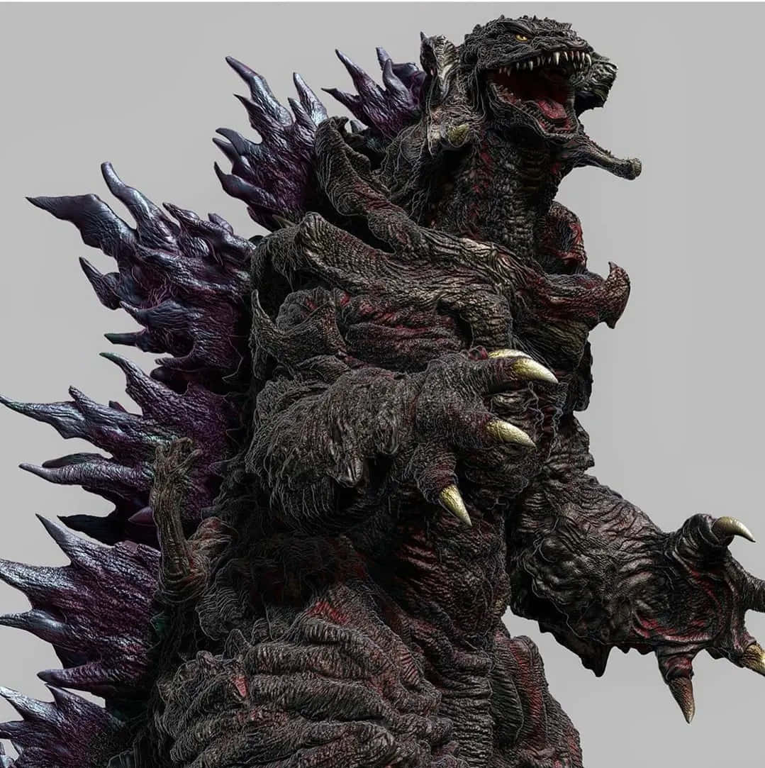 Godzilla 2000 桌布 壁紙 — 一隻帶有深色紋理皮膚和發光眼睛的威脅性哥斯拉，對著純灰色背景咆哮。