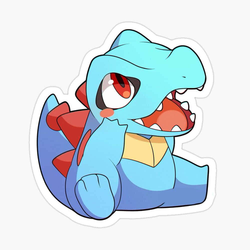 Pokemon Stickers 桌布 壁紙 — 一隻快樂的藍色卡通恐龍，有紅色尖刺和黃色肚子，張開嘴巴露出鋒利的牙齒坐著。