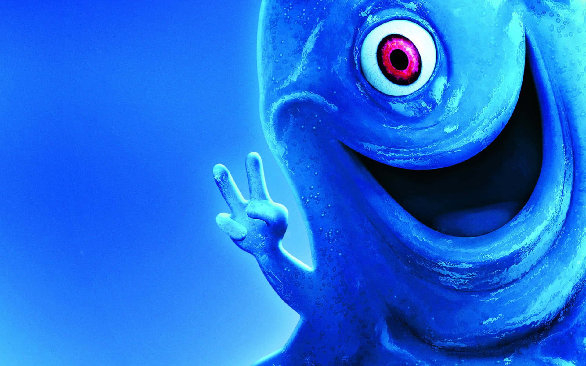 Cartoon Alien 桌布 壁紙 — 一隻快樂的藍色單眼怪物，咧嘴大笑並比出和平手勢，背景為純藍色。