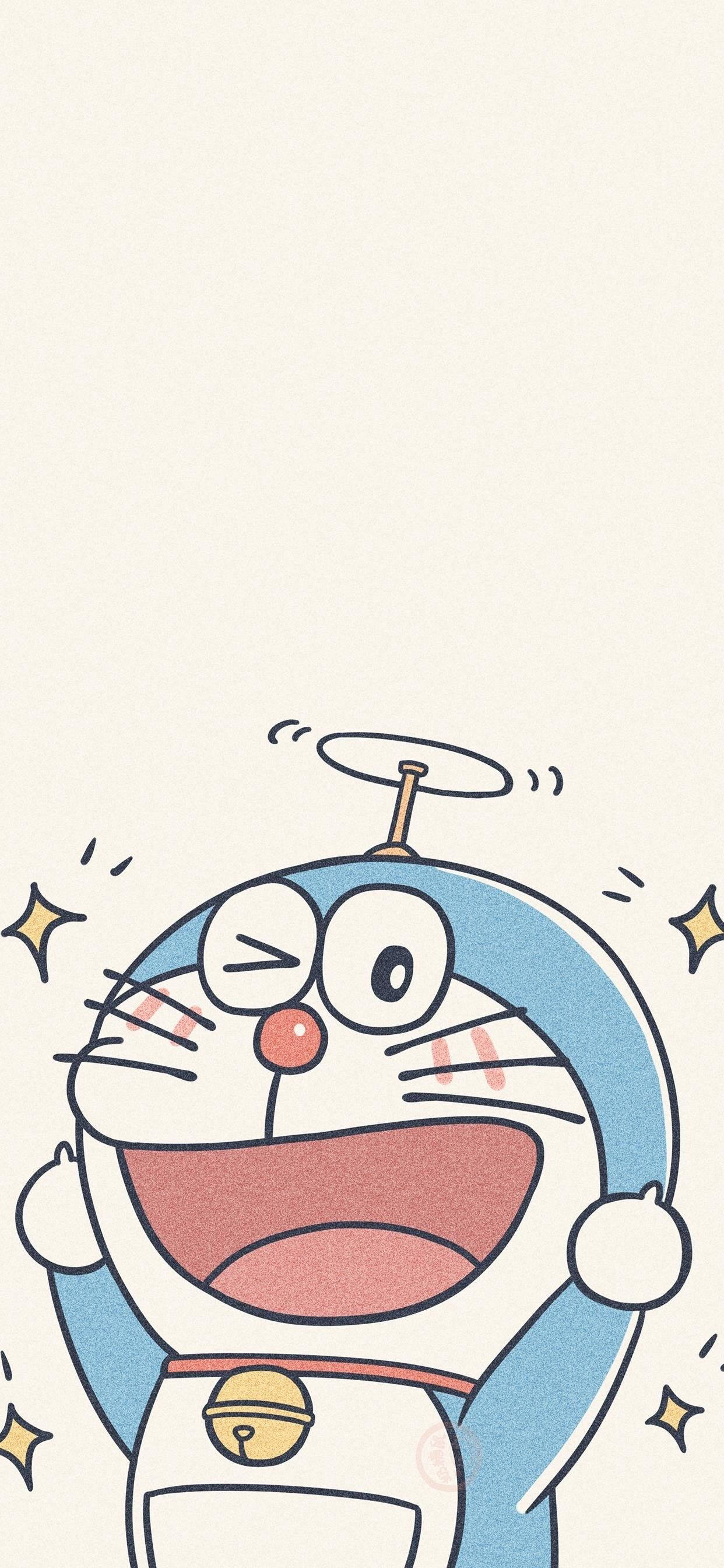 Doraemon 桌布 壁紙 — 一隻快樂的藍色機械貓，帶有旋轉天線和圍繞著它快樂臉龐的星爆。