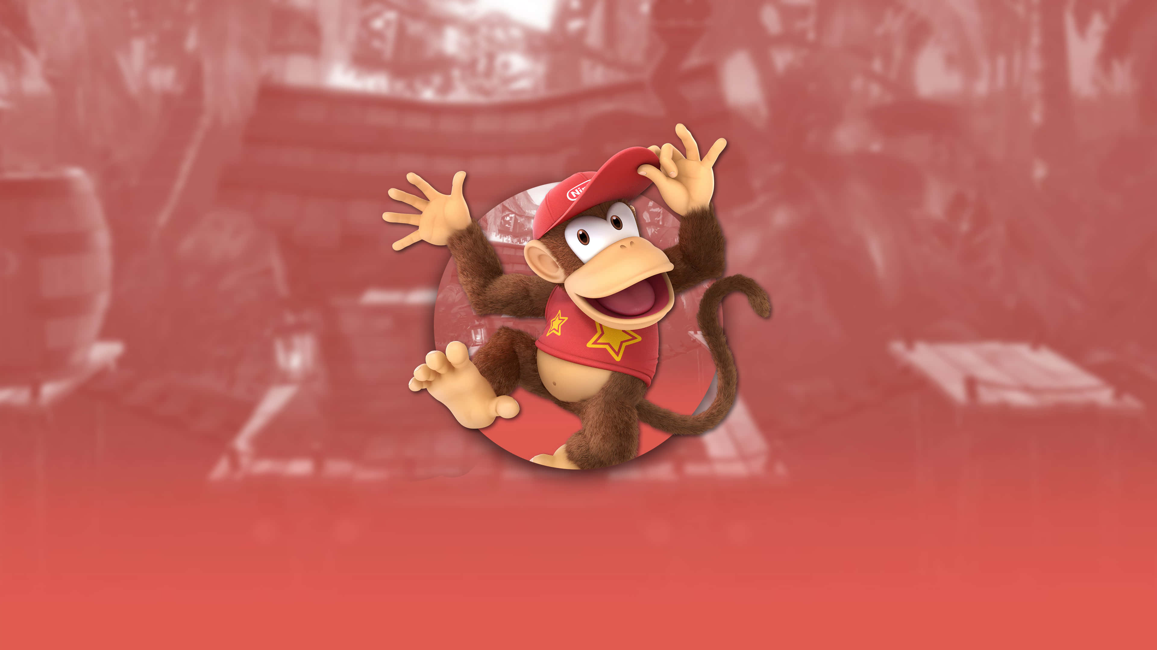 Diddy Kong 桌布 壁紙 — 一隻戴紅帽穿紅衫的開心卡通猴子，在模糊的紅色背景的圓形框架內愉快地揮手。