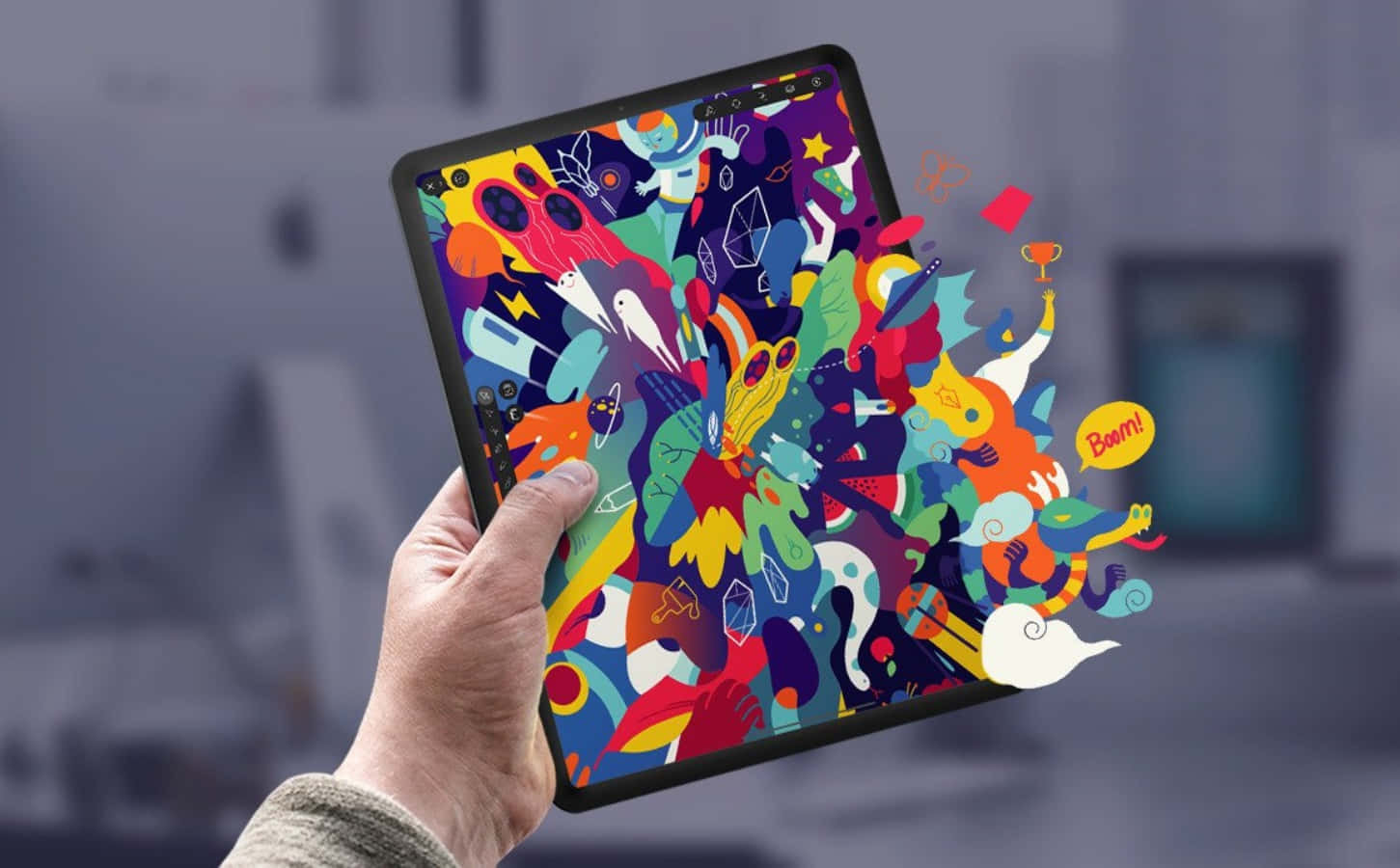 graphic design 桌布 壁紙 — 一隻手拿著平板電腦，顯示一幅充滿色彩繽紛卡通角色和物體的充滿活力的混亂數位插圖。