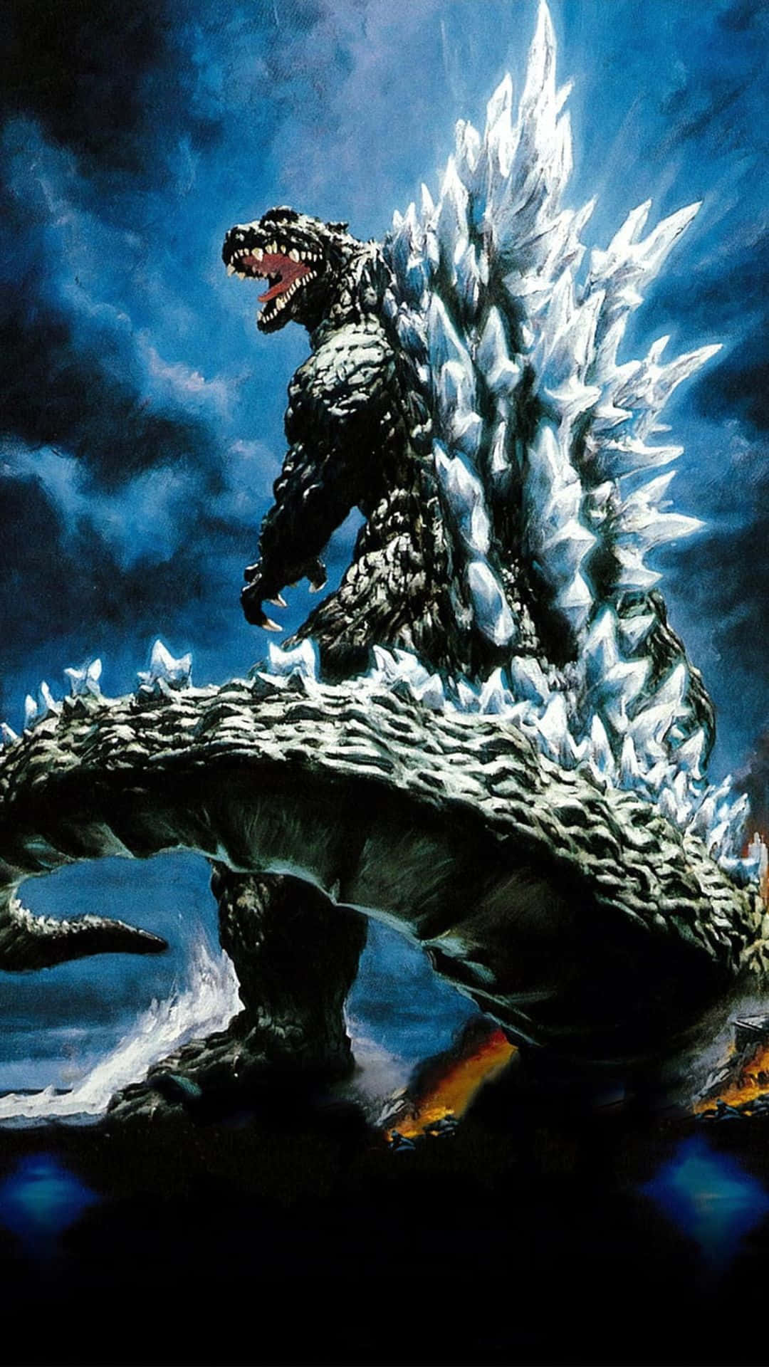 Godzilla 2000 桌布 壁紙 — 一隻擁有鋸齒狀冰刺的巨大哥斯拉在風暴藍天下，於熾熱景觀上方咆哮。