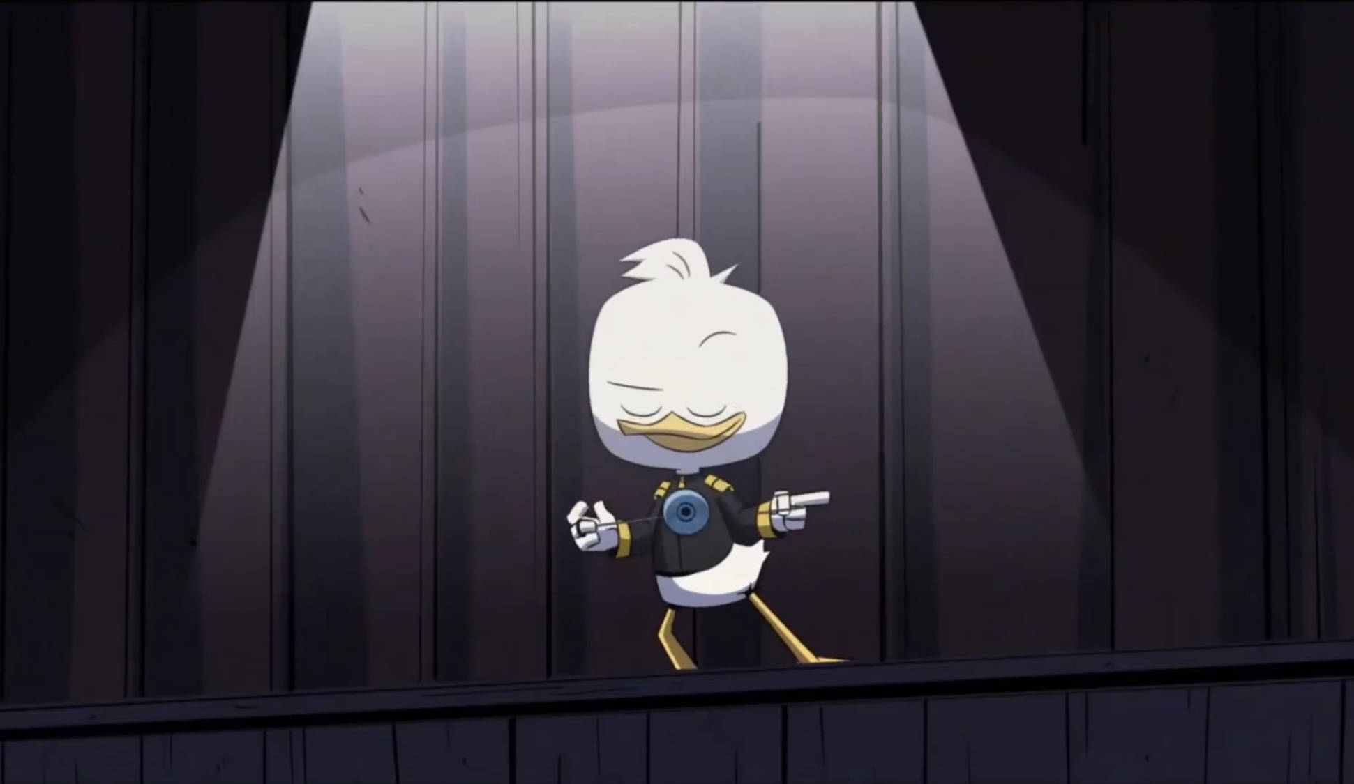 DuckTales Louie 壁紙 — 一隻穿著黑色西裝的卡通鴨自信地站在黑暗木質舞台上的聚光燈下。
