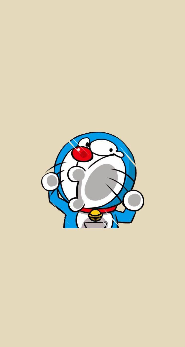 搞笑動漫GIF 桌布 壁紙 — 一隻藍色身體、紅色鼻子的卡通機械貓，在米色背景上看起來很驚訝。