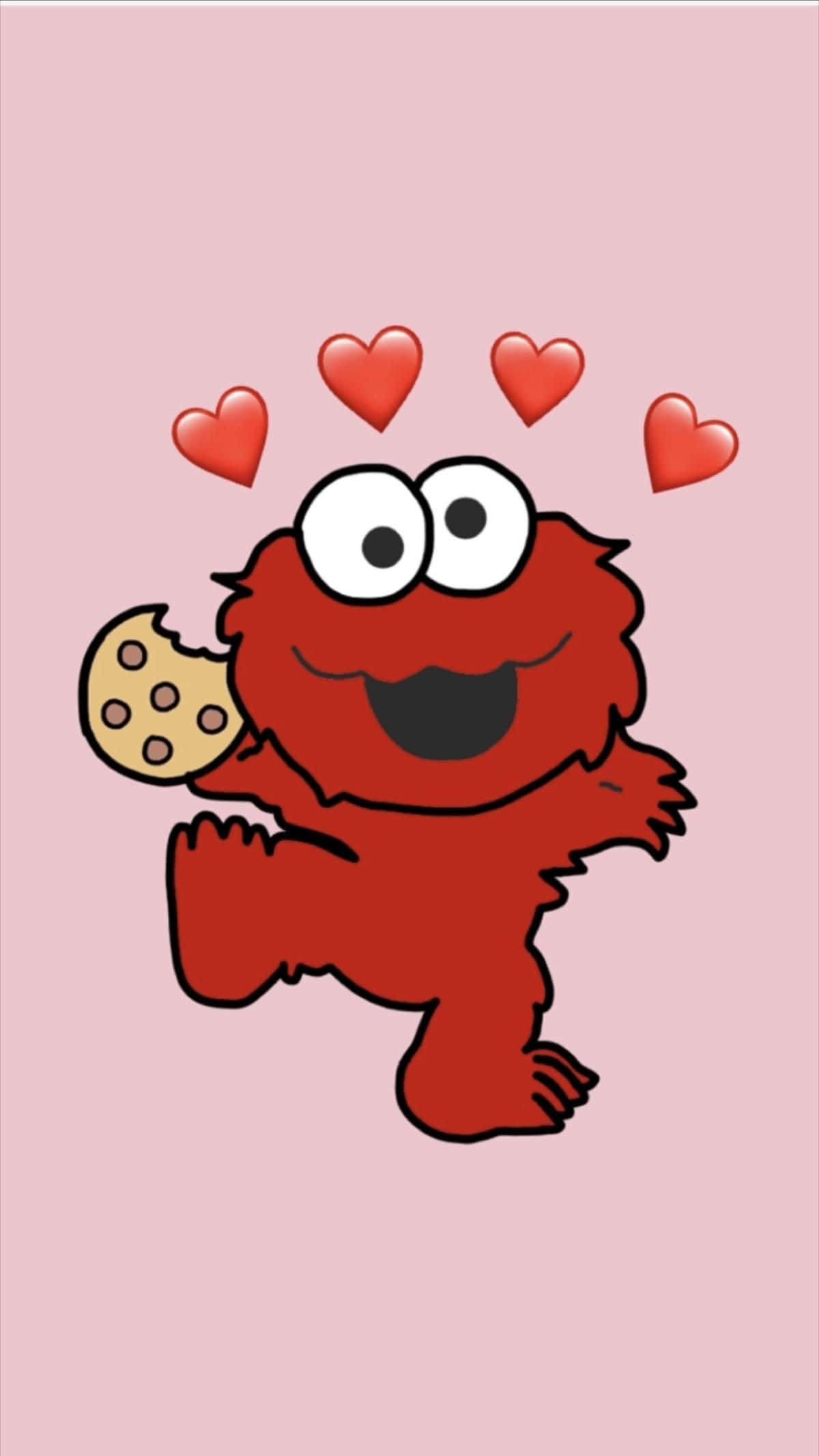 Elmo 桌布 壁紙 — 一隻開心嘅紅色卡通怪獸喺柔和粉紅色背景前，開心咁拎住一塊朱古力曲奇，頭頂有心心漂浮。