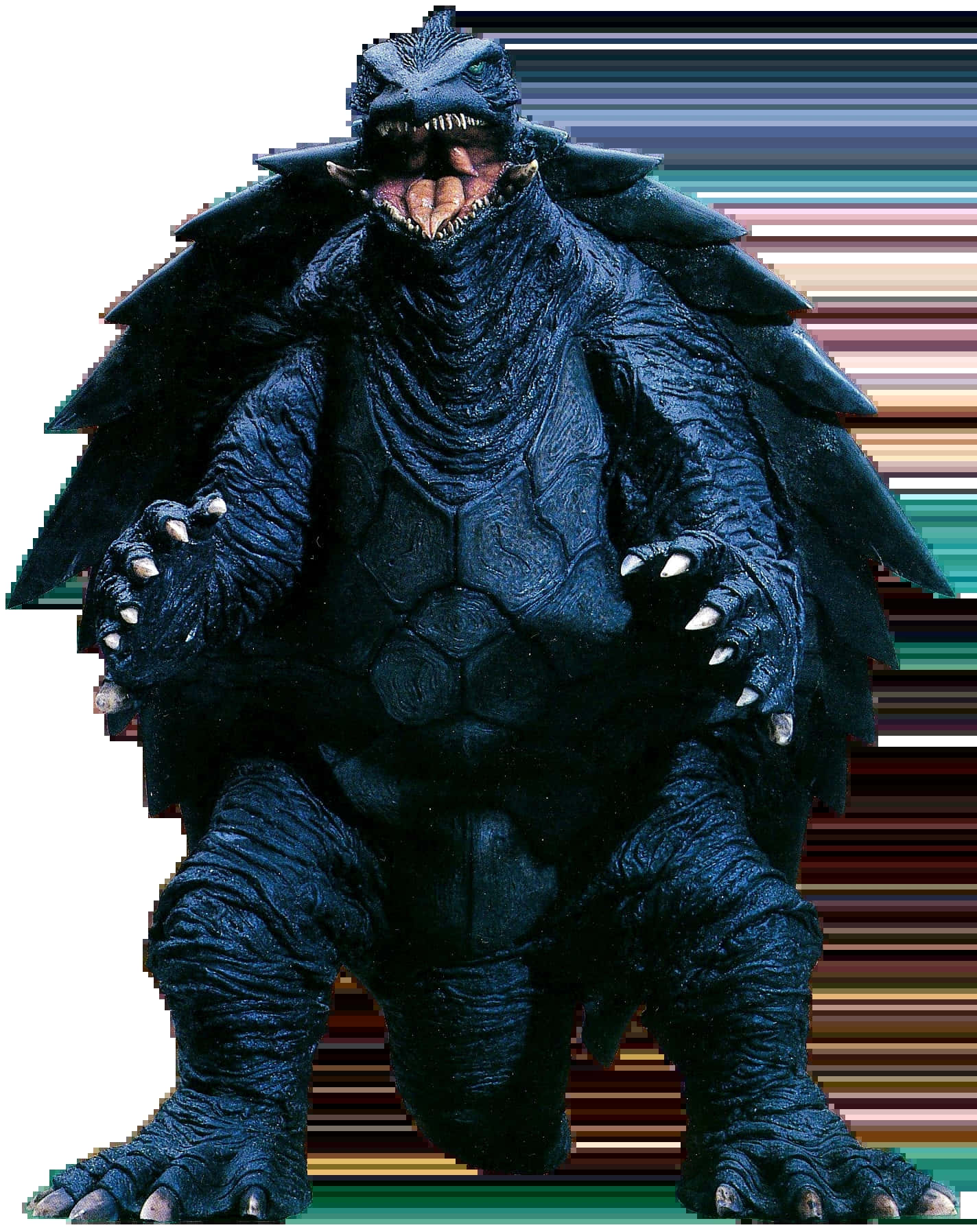 Gamera 桌布 壁紙 — 一隻高聳的深藍色哥斯拉，背上有尖刺，張開嘴巴，在條紋背景前威風凜凜地站立。