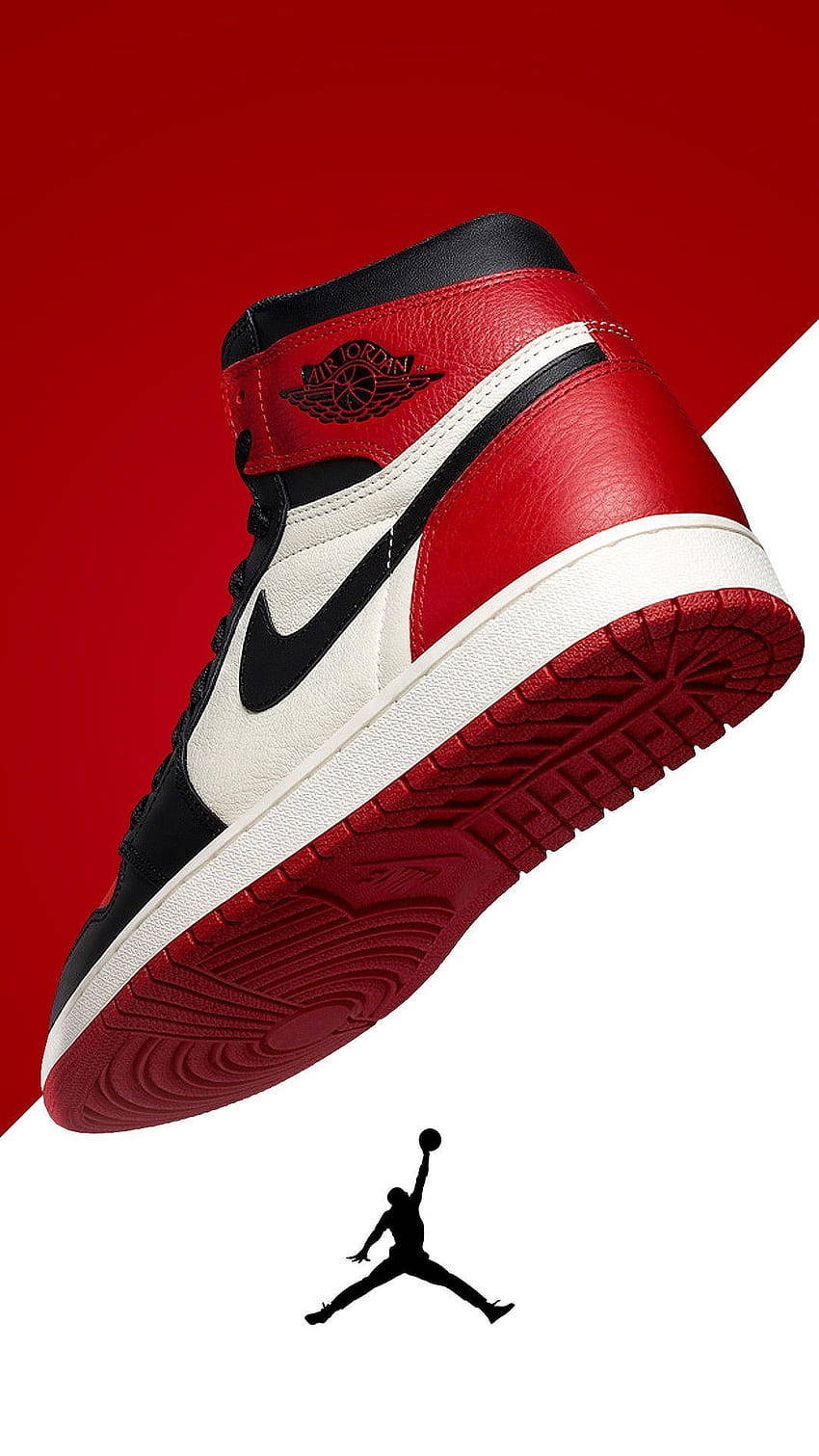 Air Jordan 桌布 壁紙 — 一雙紅黑白色Jordan 1波鞋以對角線漂浮在鮮明的紅白分割背景上，下方有Jumpman標誌。