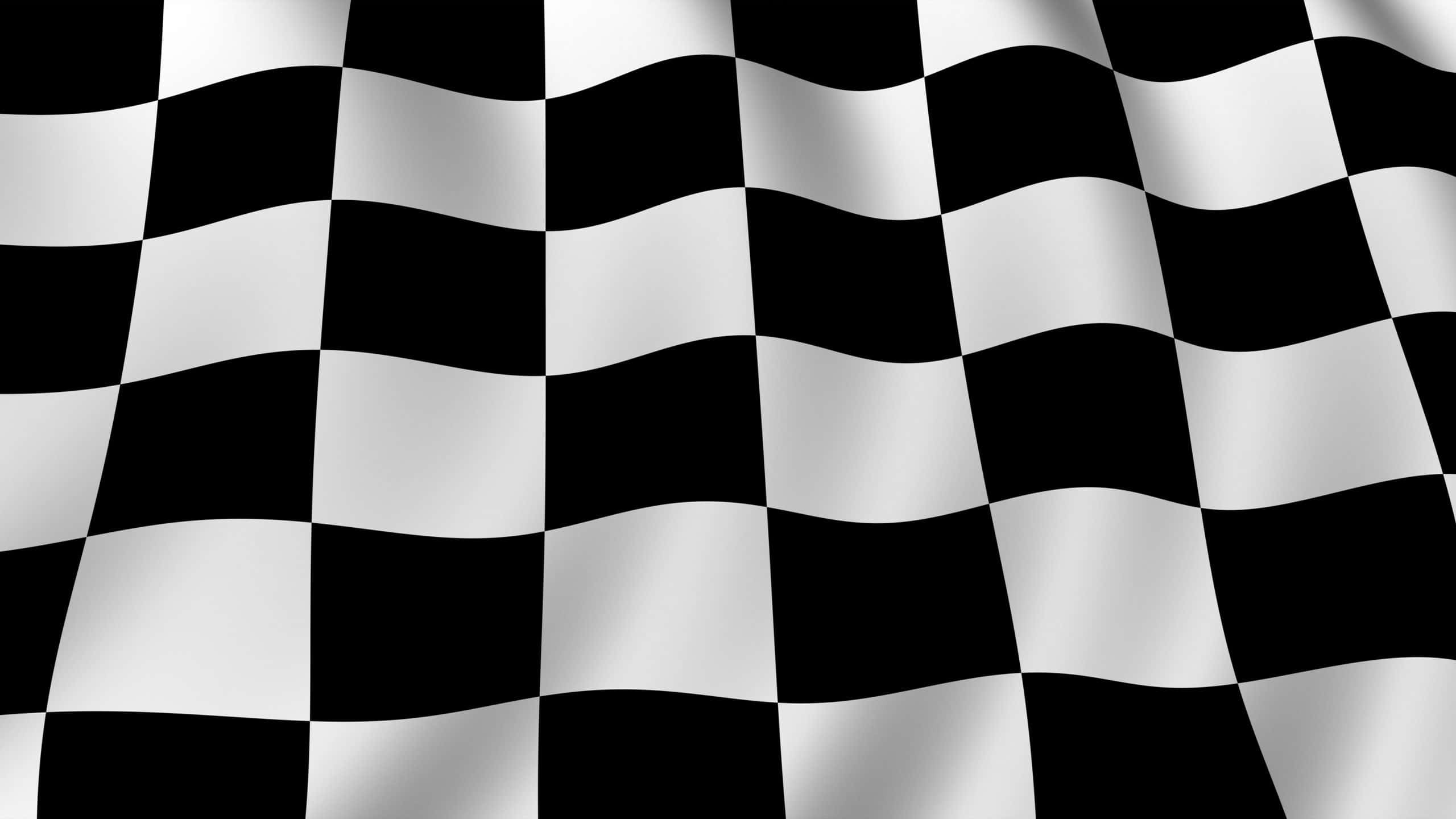 Checkered Flag 桌布 壁紙 — 一面動感的黑白格仔旗在純色背景上飄揚，帶有清晰的摺痕和閃亮的高光。