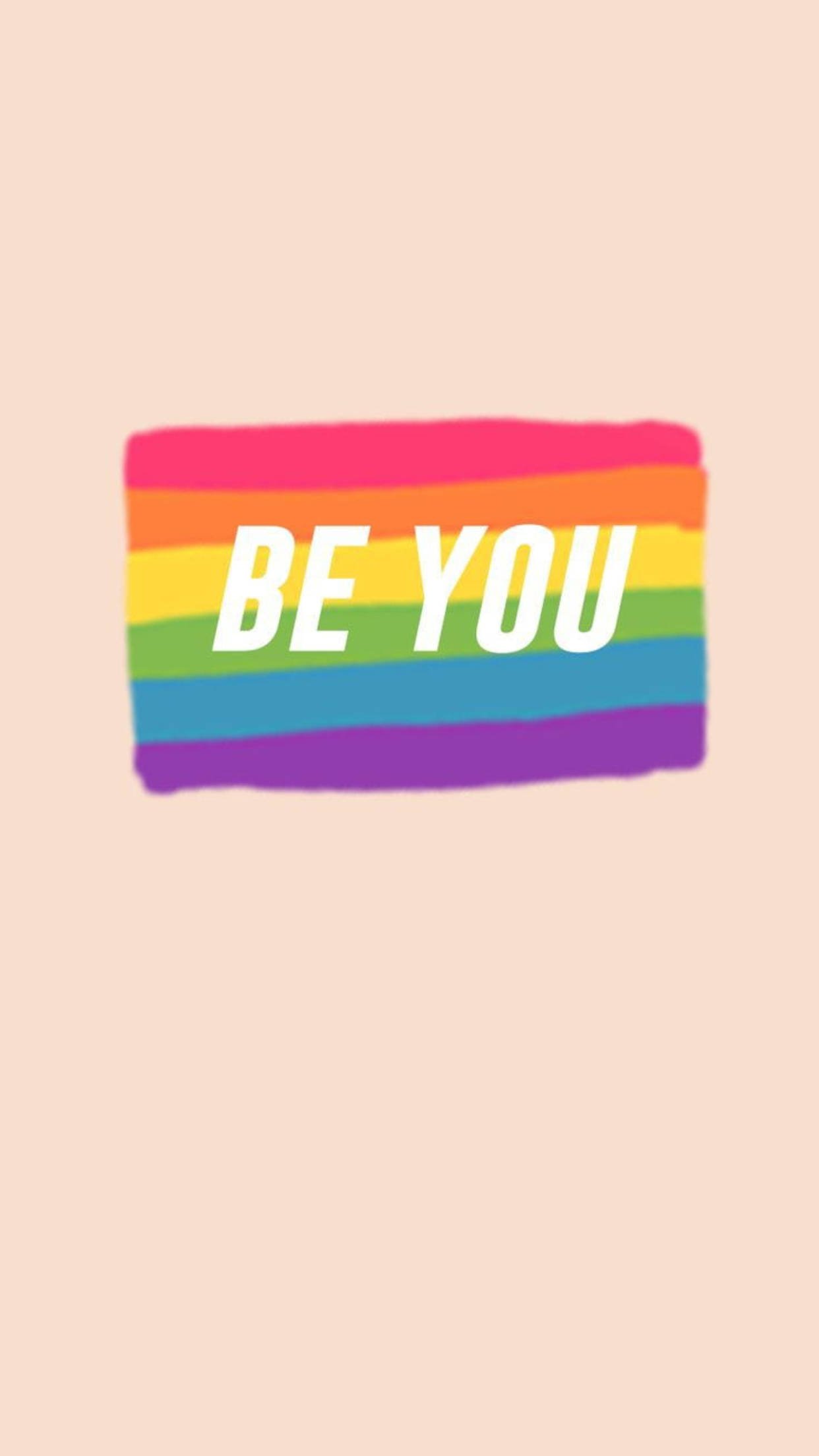 動力 桌布 壁紙 — 一面鮮豔的彩虹旗，中央有粗體白色文字 'BE YOU'，置於柔和蜜桃色背景上。