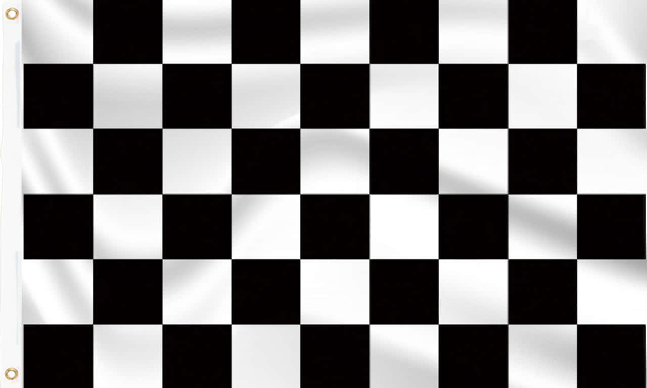 Chequered Flag 桌布 壁紙 — 一面黑白格仔賽車旗在風中飄揚，可見布料摺痕和旗桿上的金屬圈。