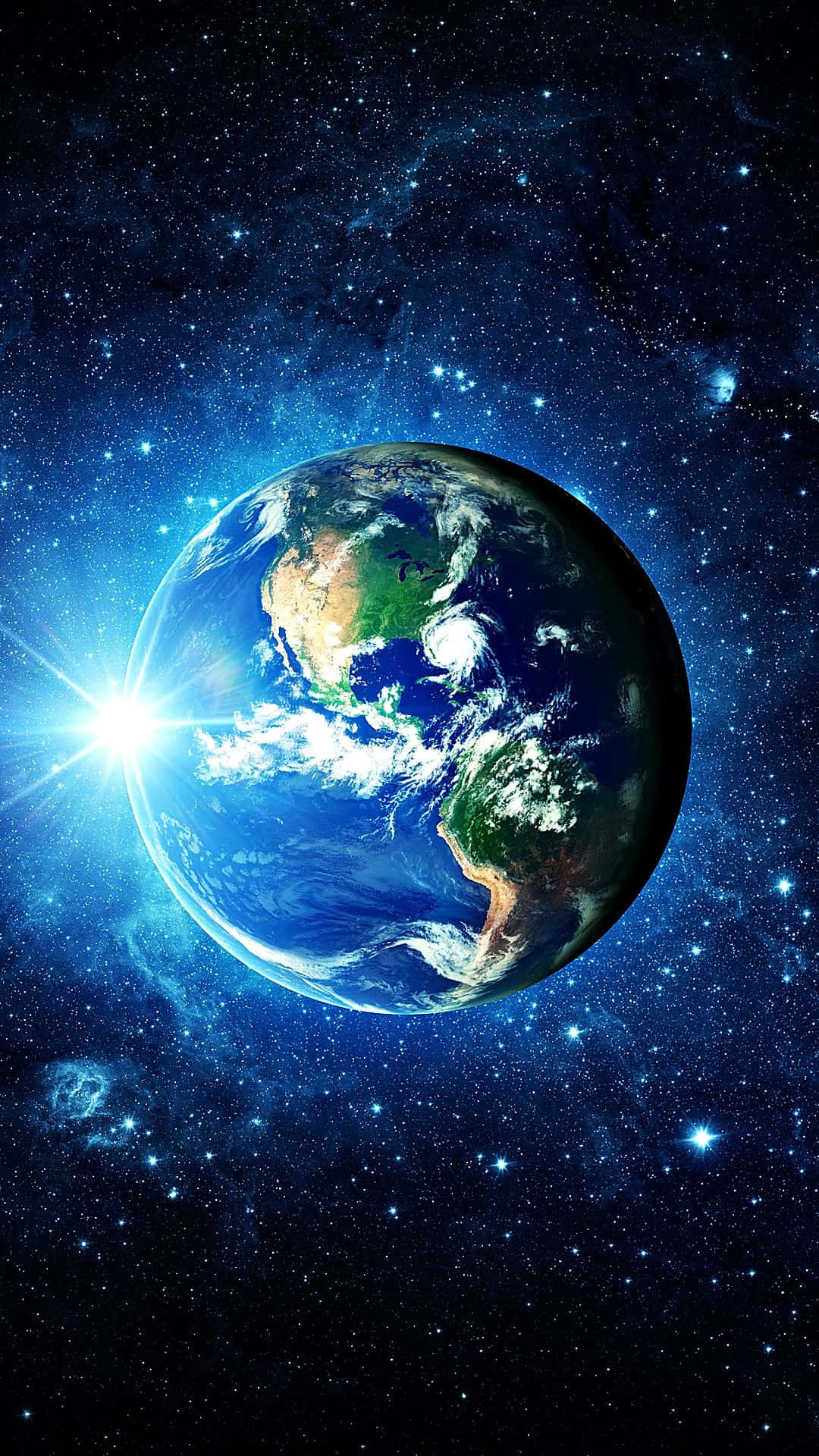 3d Earth 桌布 壁紙 — 一顆充滿活力的藍色地球在深邃太空中旋轉，燦爛的太陽光芒照亮了其旋轉的雲層和海洋。