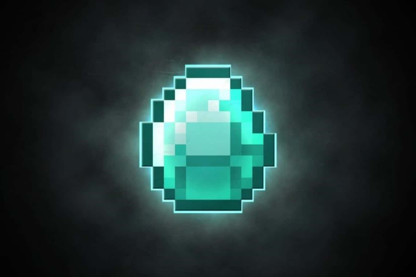 Cool Minecraft 桌布 壁紙 — 一顆發光的青綠色像素寶石在黑暗煙霧背景中散發光芒。
